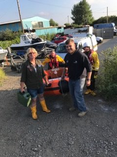 Crew carrying XP boat for launch.