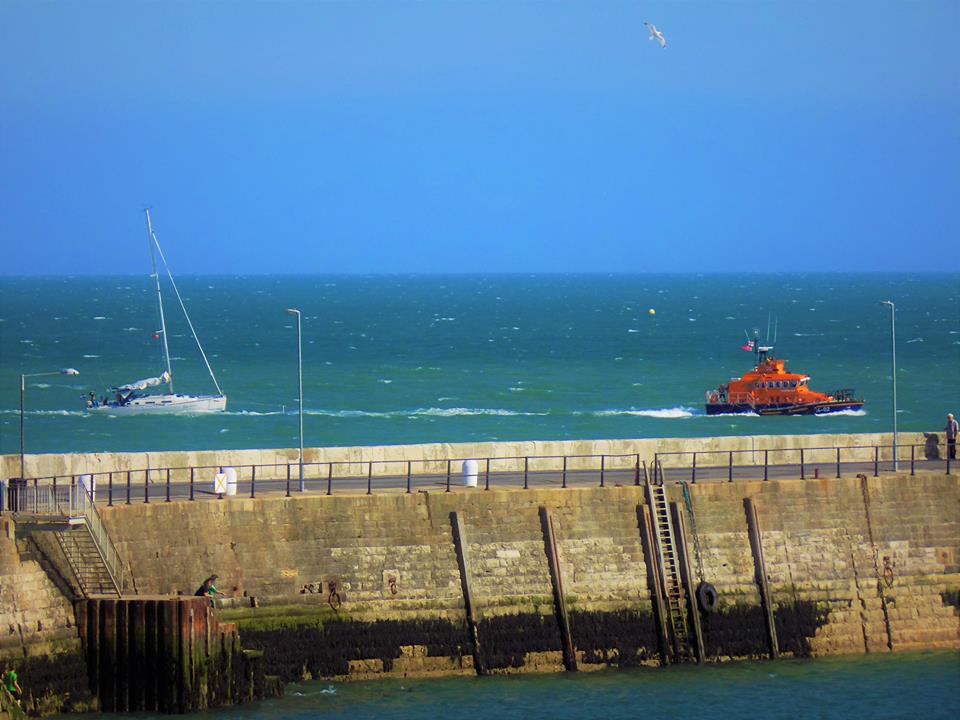 Lifeboat towing casualty yacht into Ramsgate Harbour 