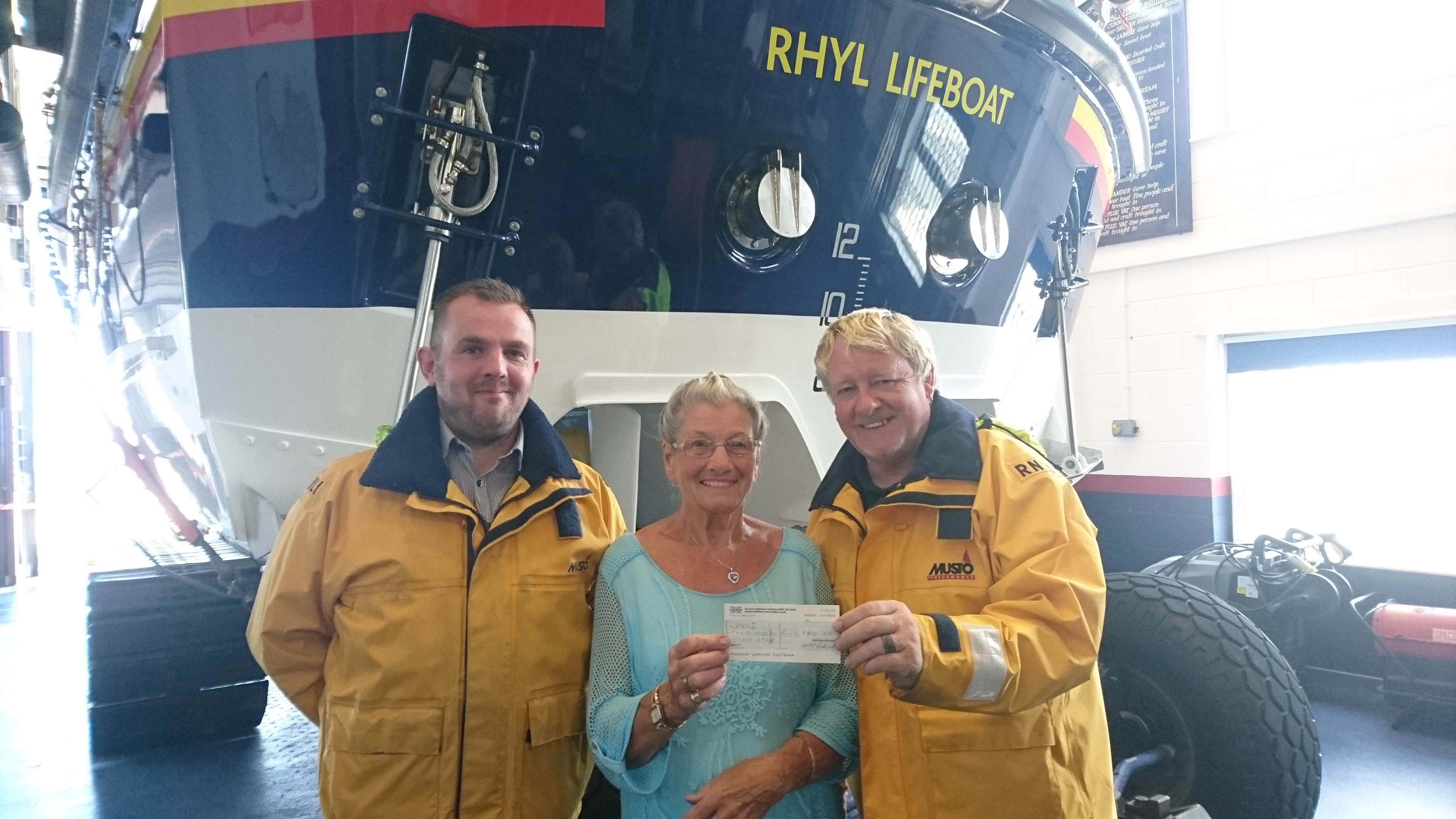 Mrs. Lockwood of Stoke-on-Trent, presents cheque to crew. L-R Dave Clark, Mrs. Lockwood, Derek Denton