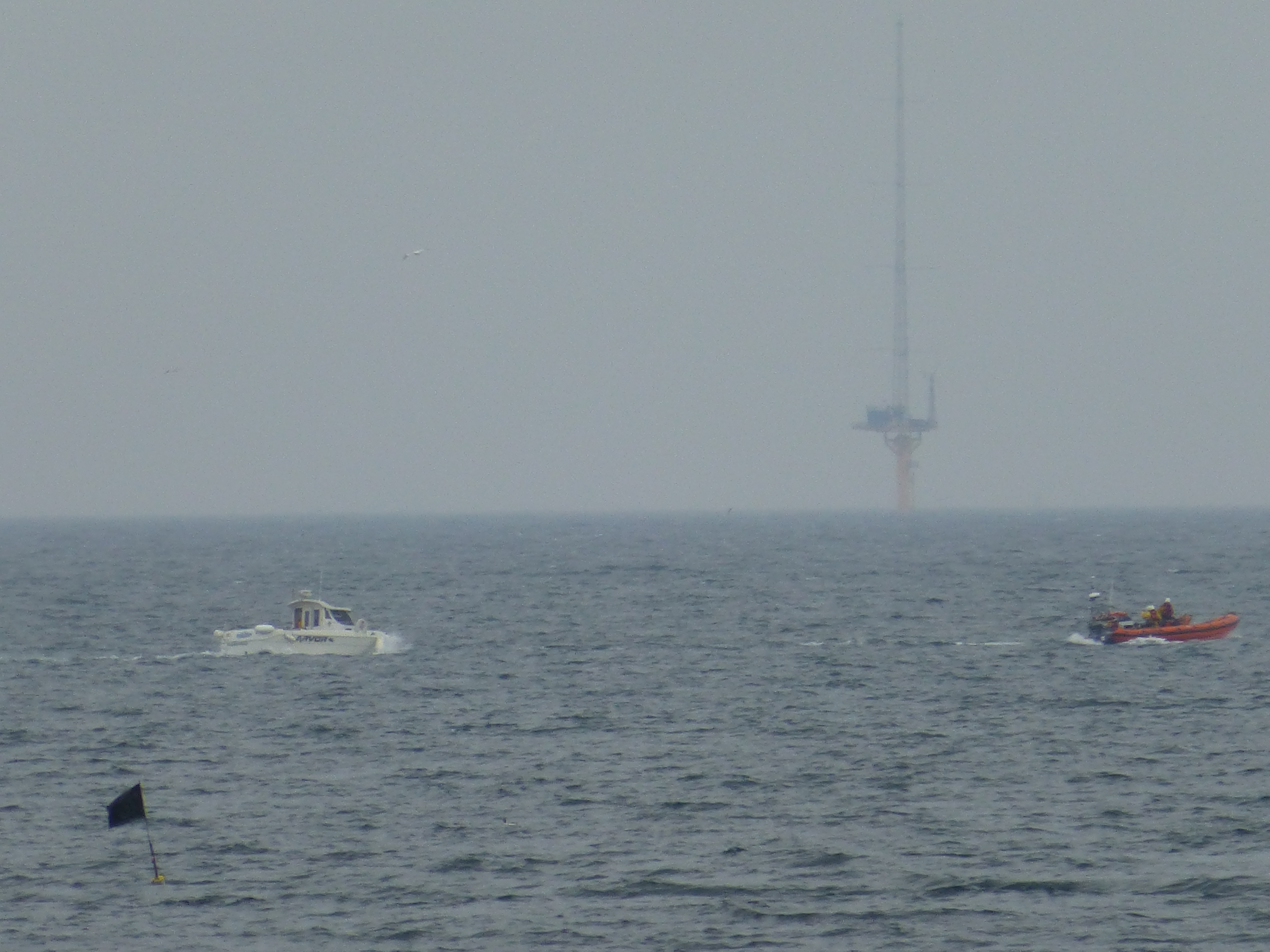 Newbiggin with casualty in tow with wind mast in the background