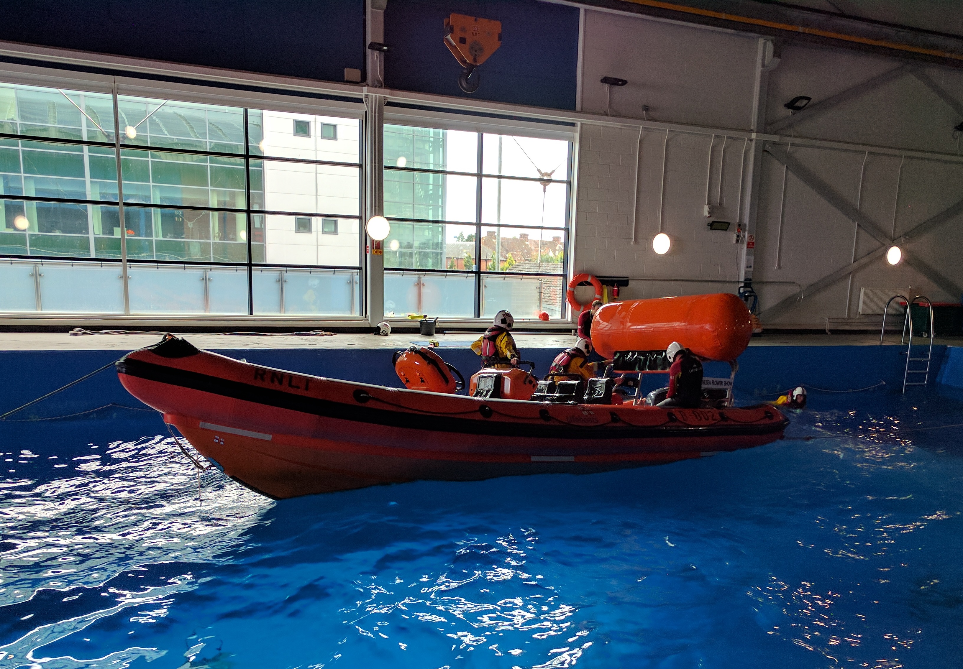 RNLI volunteers training to use the self righting capability of the Atlantic 85 ILB.