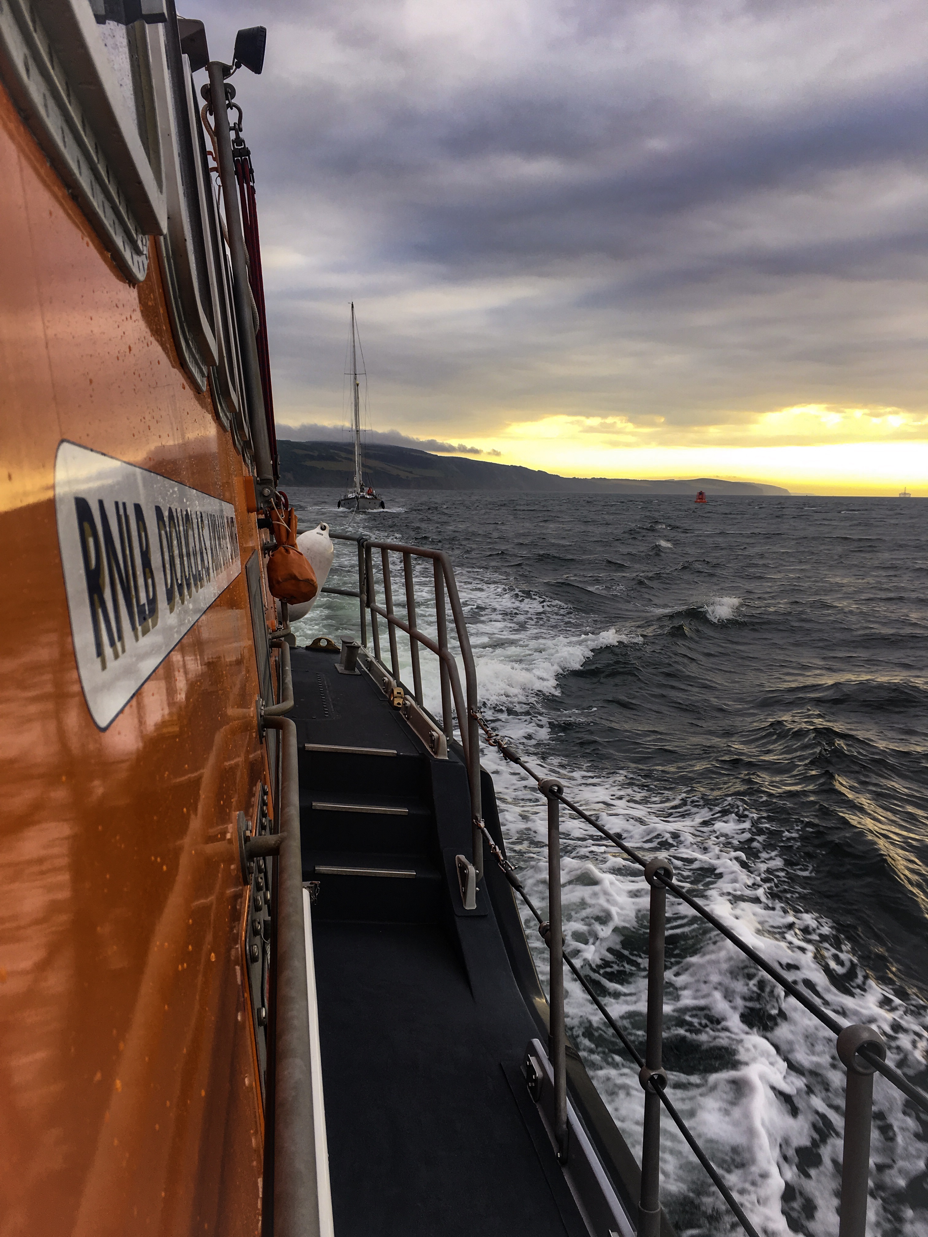 Invergordon Lifeboat with causality vessel under tow