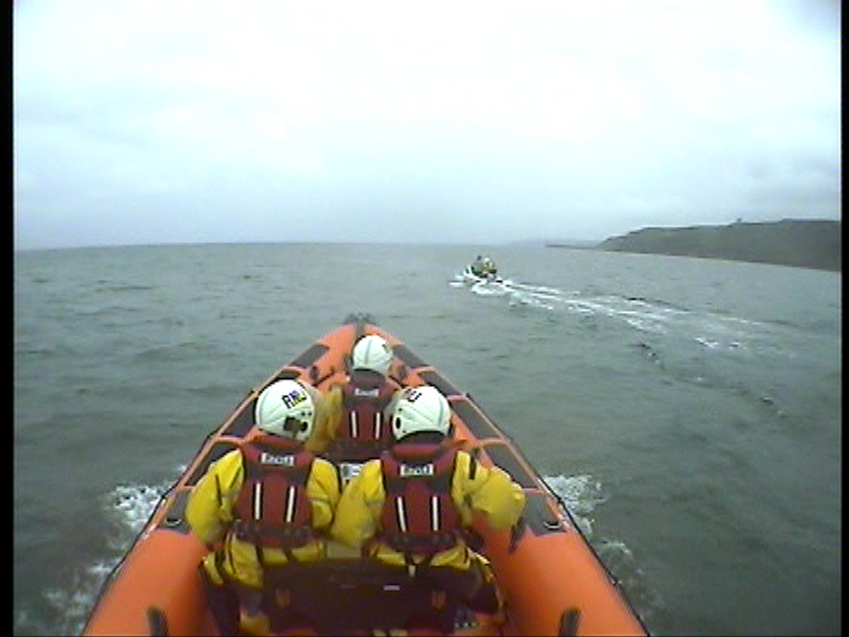 Escorting the fishing boat back to were their trip started