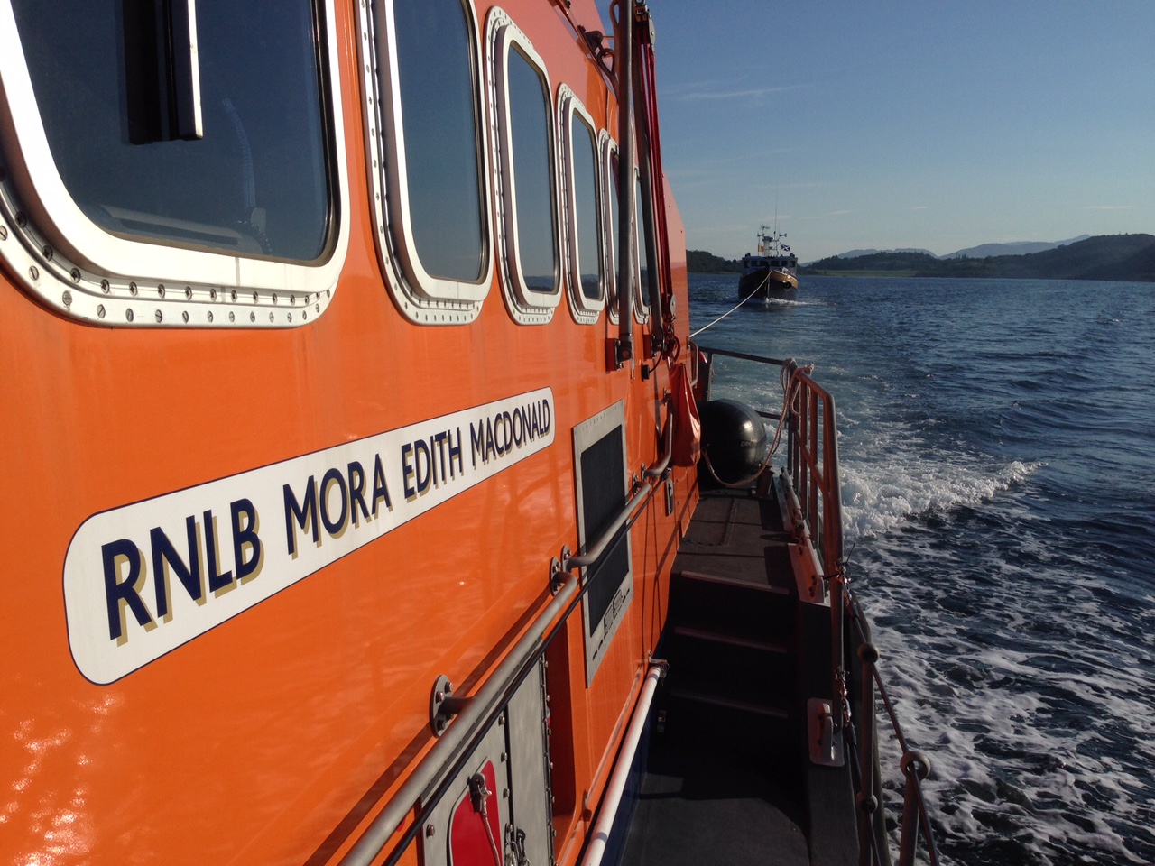 Oban lifeboat with the vessel under tow