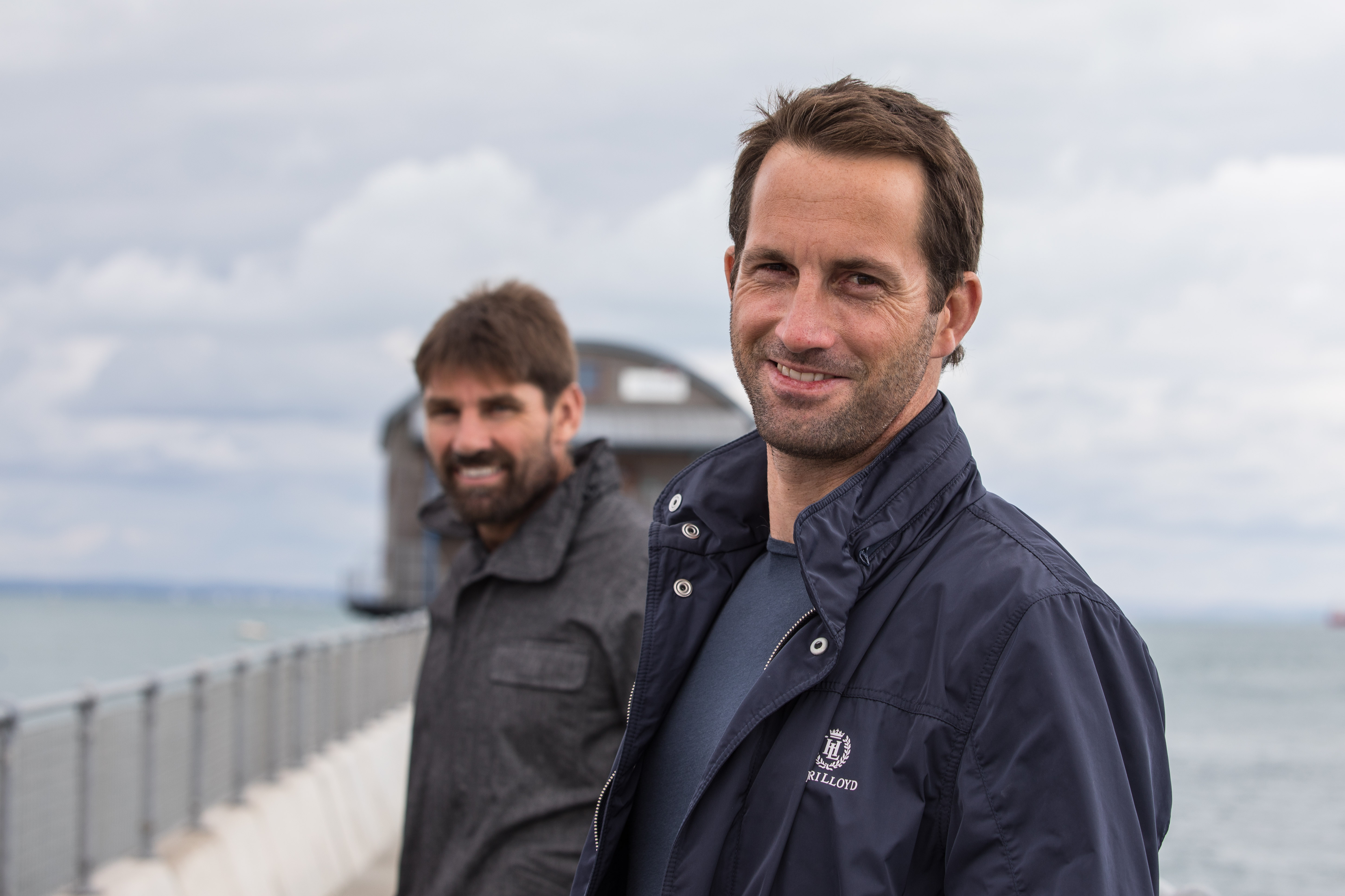 Sir Ben Ainslie and Jono Macbeth in front of Bembridge RNLI Lifeboat Station
