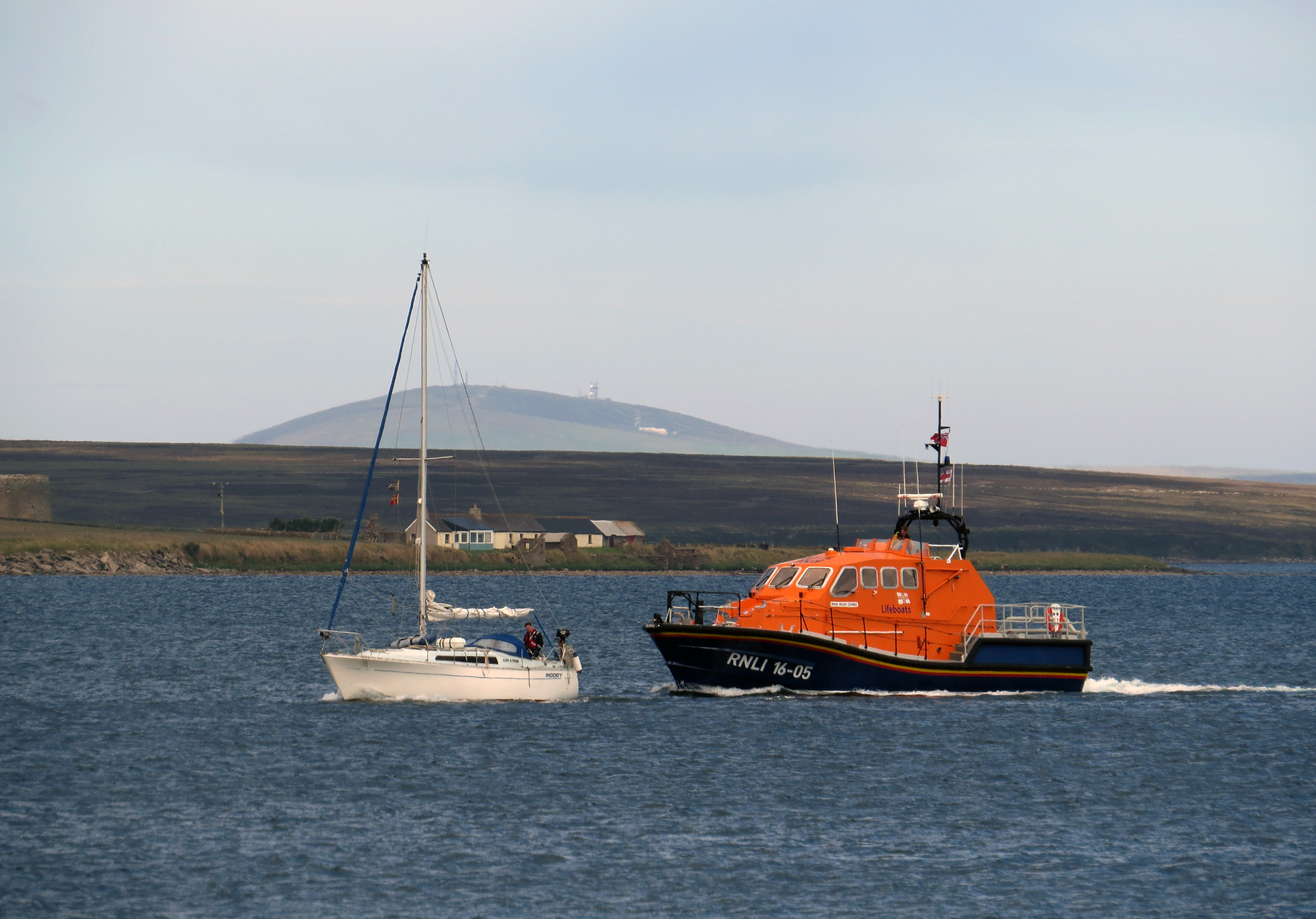 RNLI Longhope lifeboat crew members retrieve unmanned yacht and return to Longhope