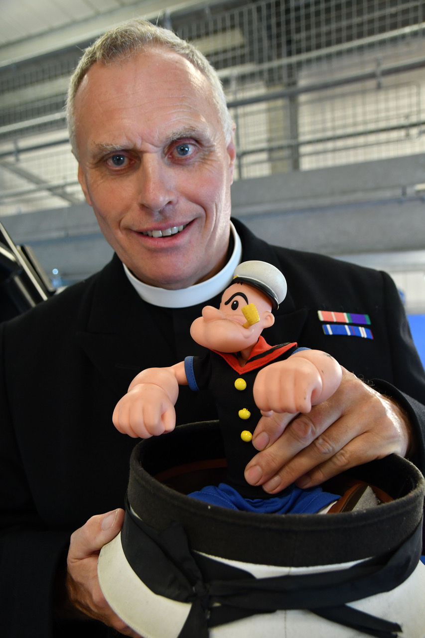 Angle RNLI's Deputy Launch Authority, the Rev Mike Brotherton, retired Royal Navy Chaplain, with the Popeye mascot used to illustrate his address at the lifeboat station's Sea Sunday service on July 30