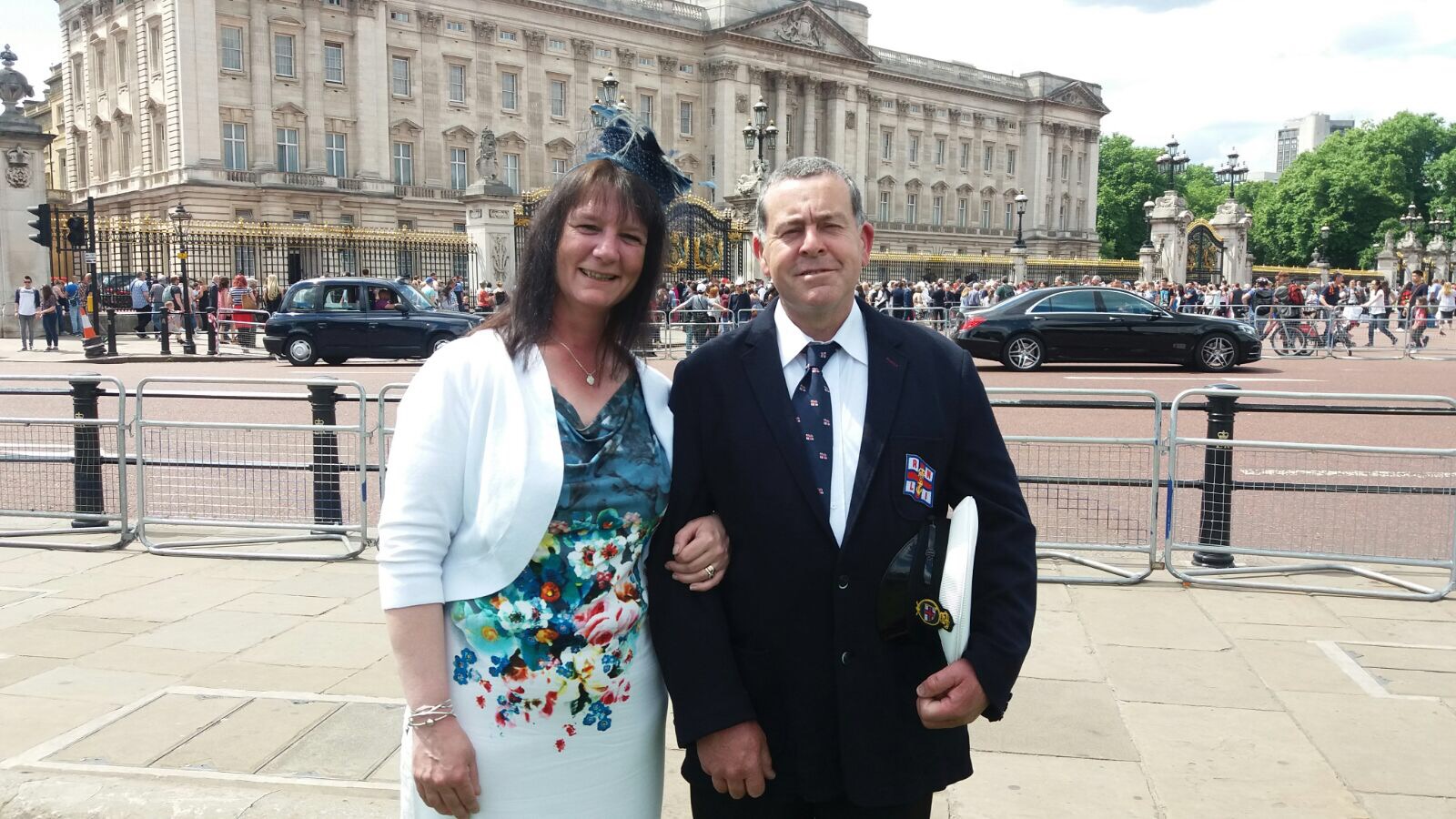 Volunteer Mechanic/Helmsman Paddy and his wife Karen pictured outside Buckingham Palace.