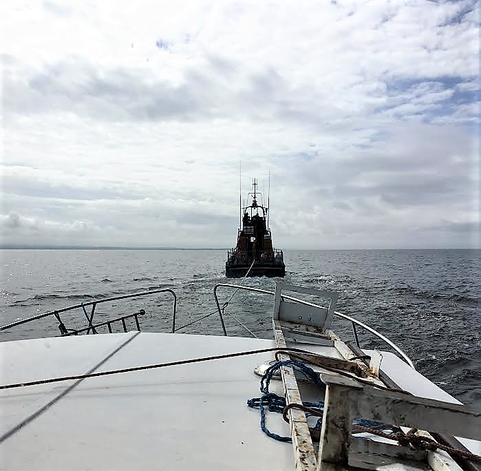 The casualty vessel under tow to Troon by RNLB Jim Moffat