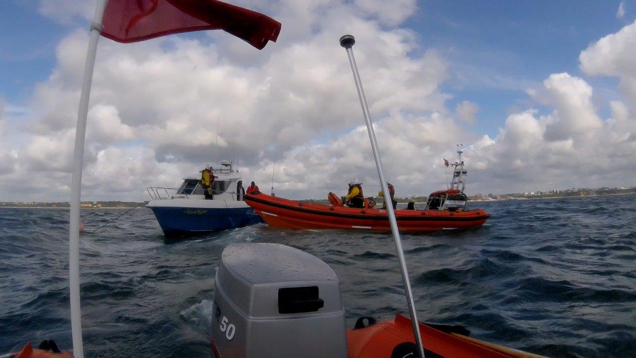 A 25ft fishing boat with two people on-board had broken down, it had encountered engine failure and was at anchor.