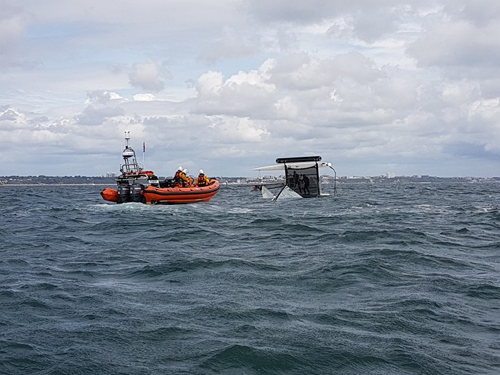 Poole Lifeboat come to the aid of a 18ft Catamaran that had capsized south of Hook sands