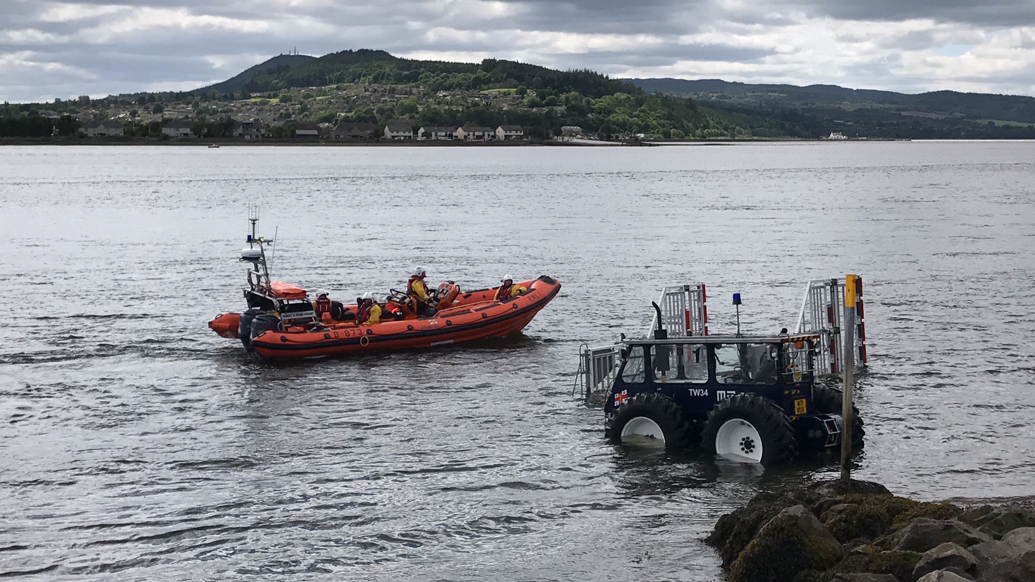 RNLI Kessock lifeboat returning to station following rescue of 2 sailors