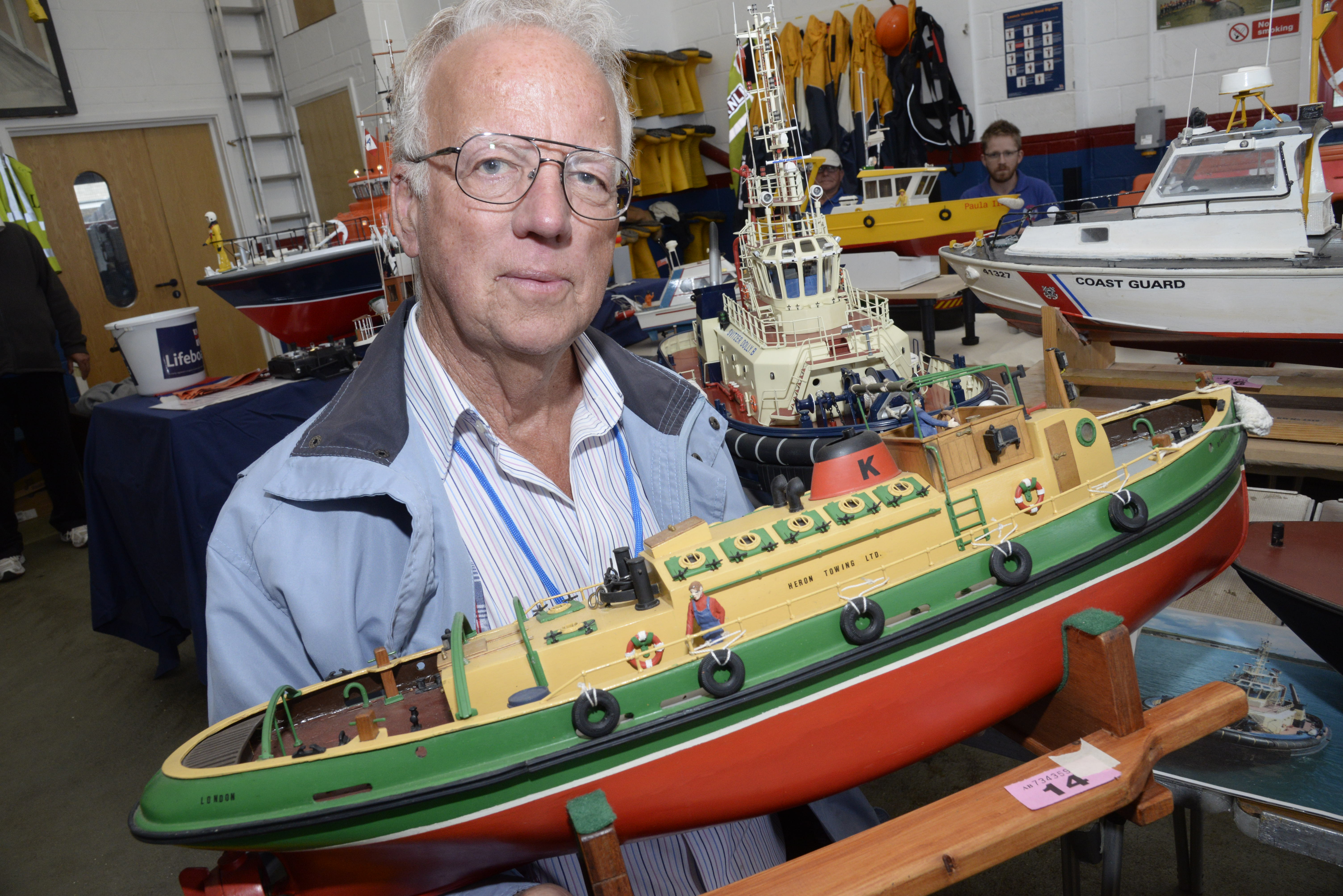 The Heron Model Boat Club's Ray Darvell with his model Tug built by the late Pat Kemp who was a helmsman and later Deputy Launching Authority at Whitstable Lifeboat during the model boat exhibition at the Lifeboat Station on Sunday. Picture: RNLI Whitstable