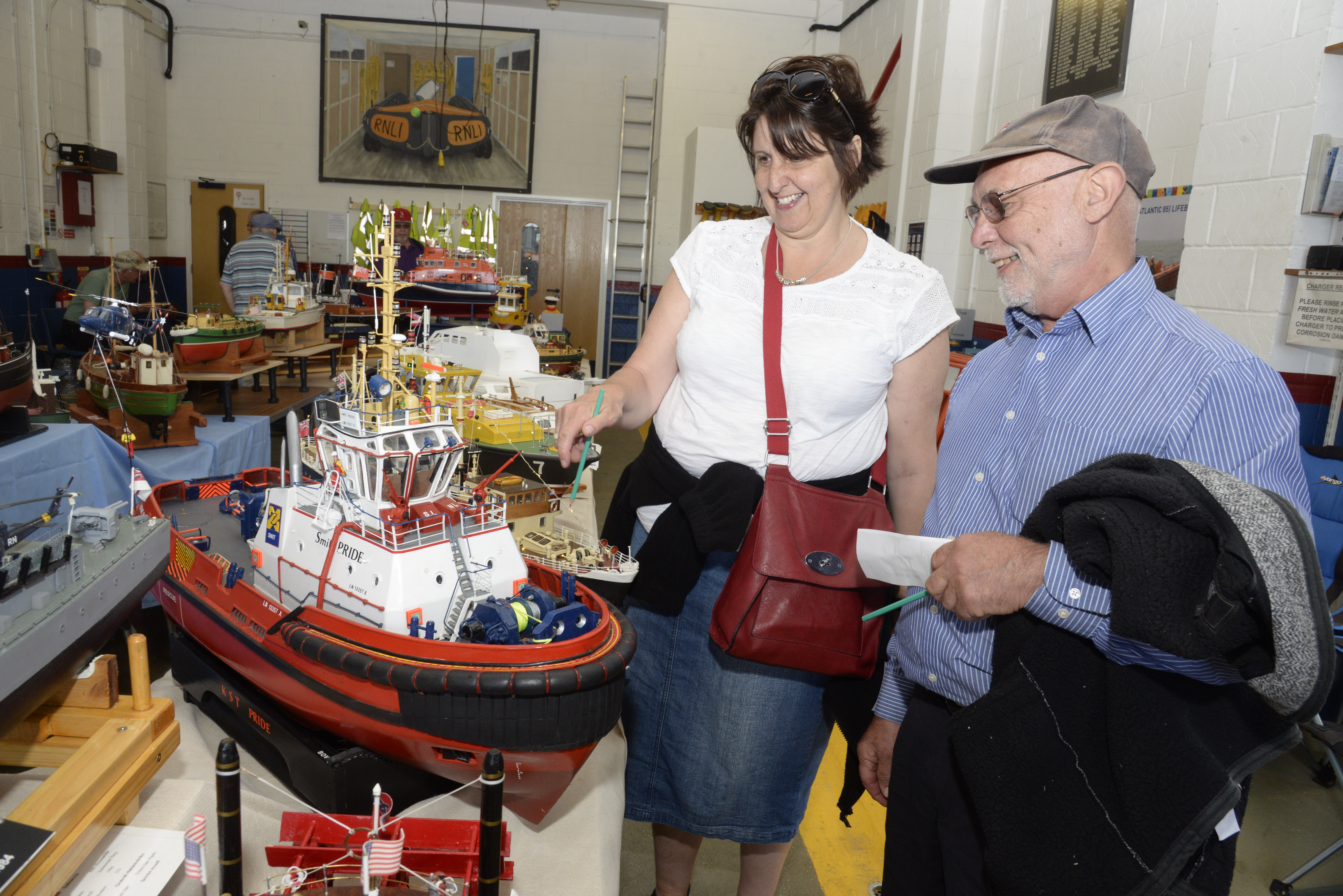 Carol and Ron Church take a look at some of the many models on display at the model boat exhibition at Whitstable Lifeboat Station on Sunday. Picture: RNLI Whitstable