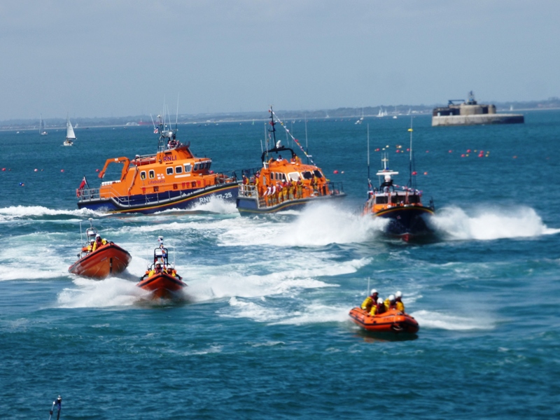 Five lifeboats lining up for a sail past