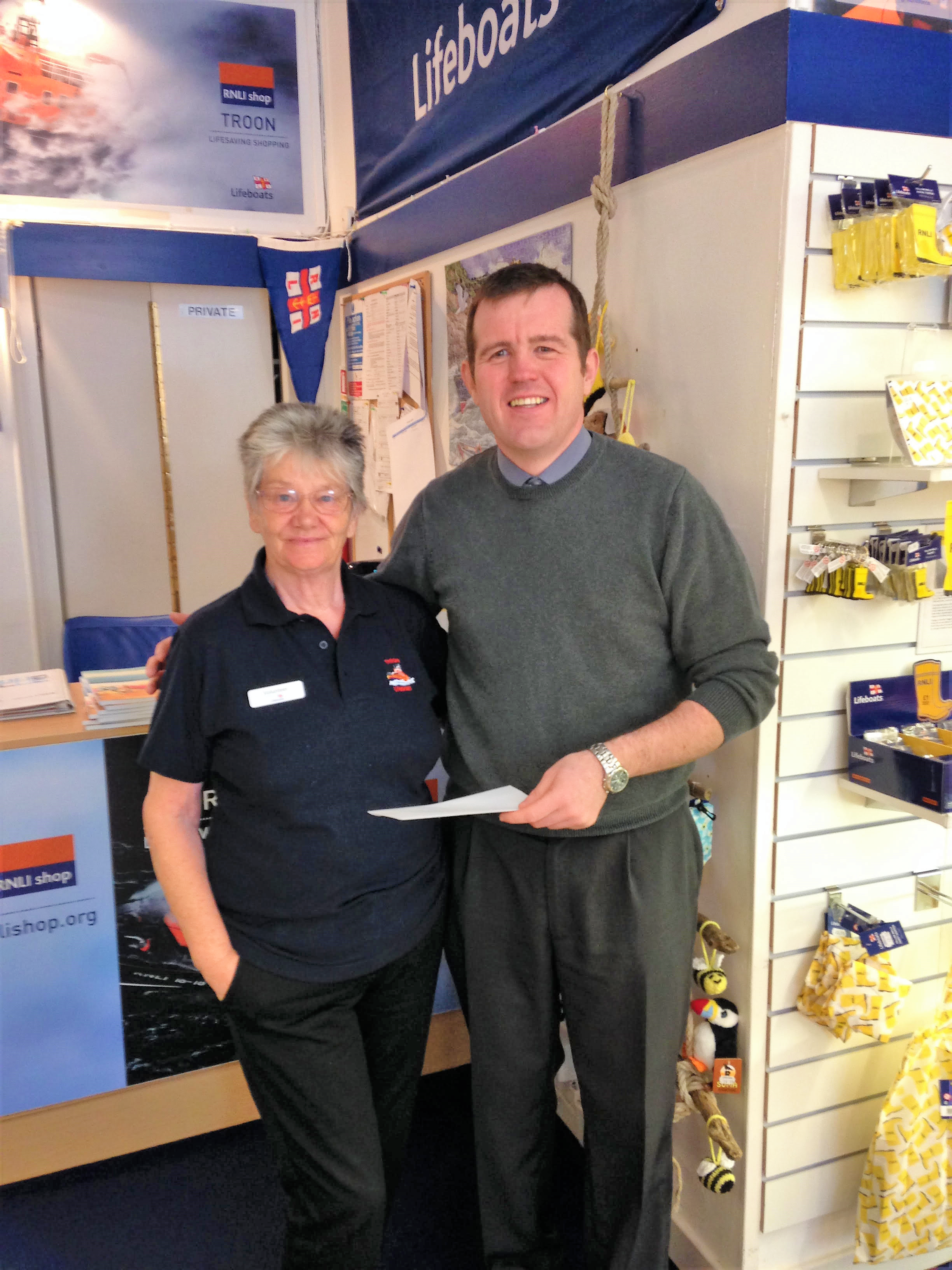 David Miller from TR Callans presented the cheque to Frances Wong, one of our RNLI shop volunteers.