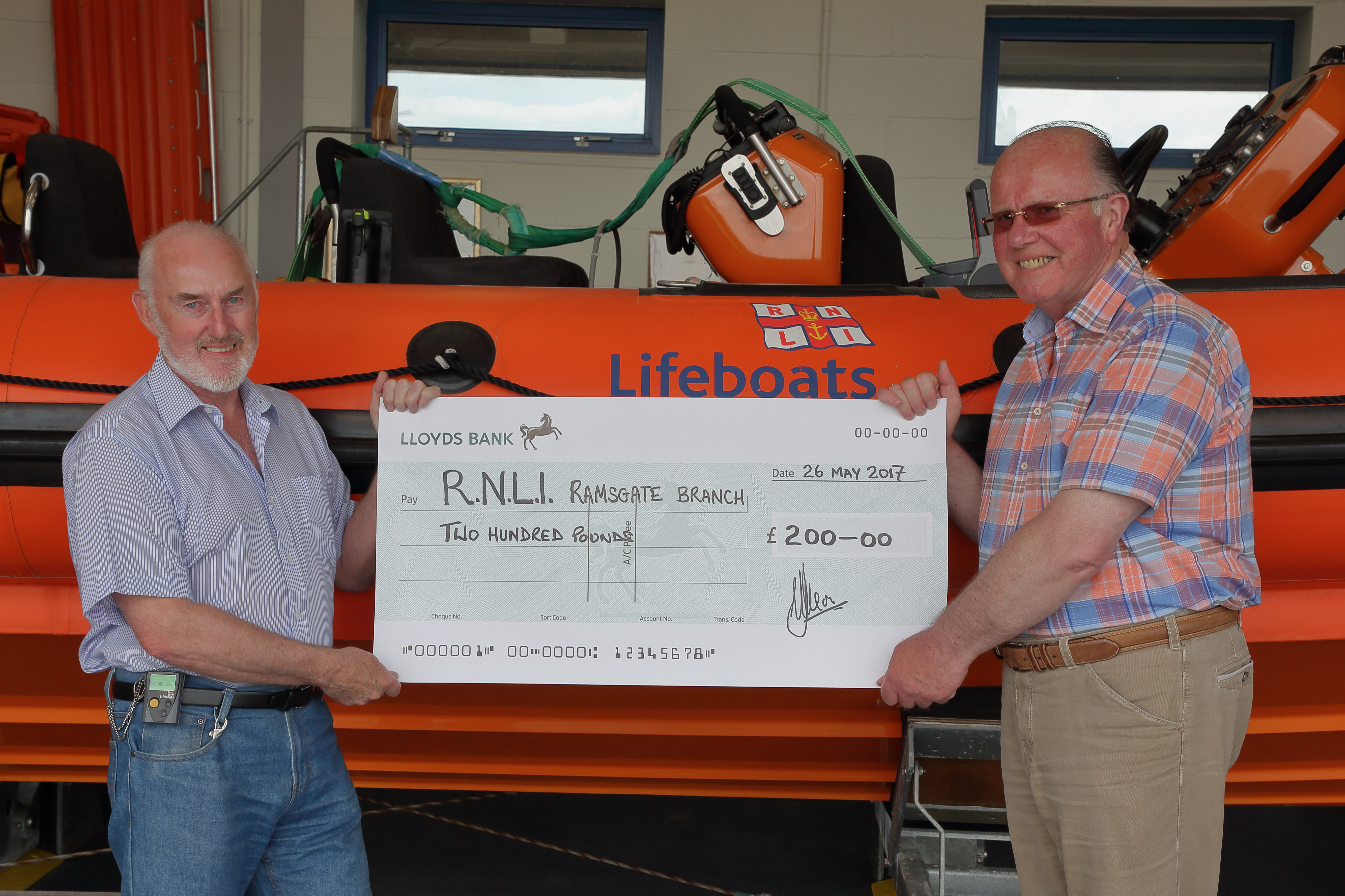 Ray Noble receiving cheque for Ramsgate RNLI