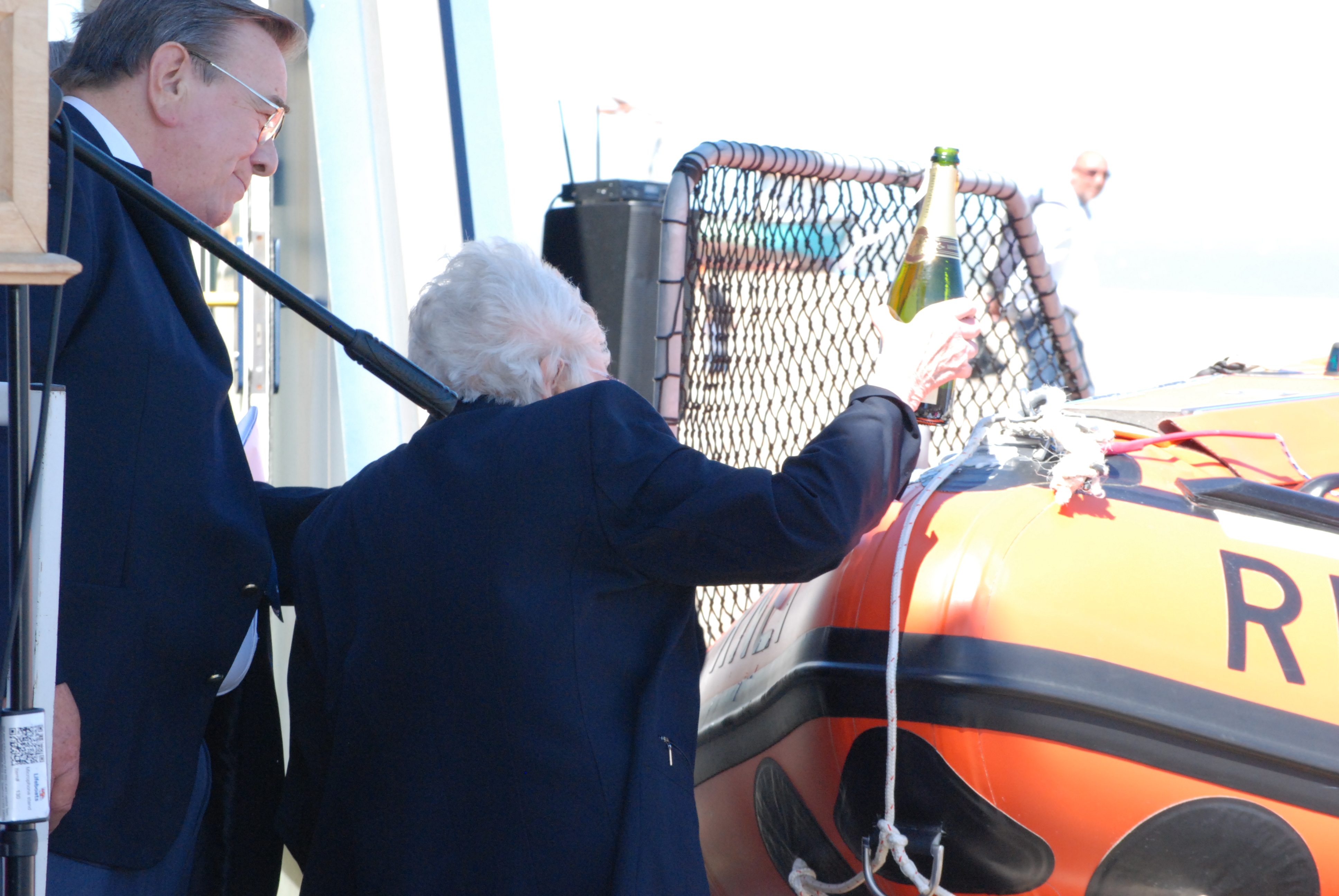 Sue Scott helps name the new lifeboat with the traditional champagne blessing