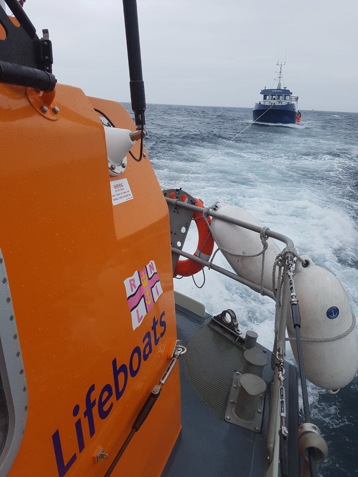 Leverburgh Lifeboat towing 16m fishfarm vessel