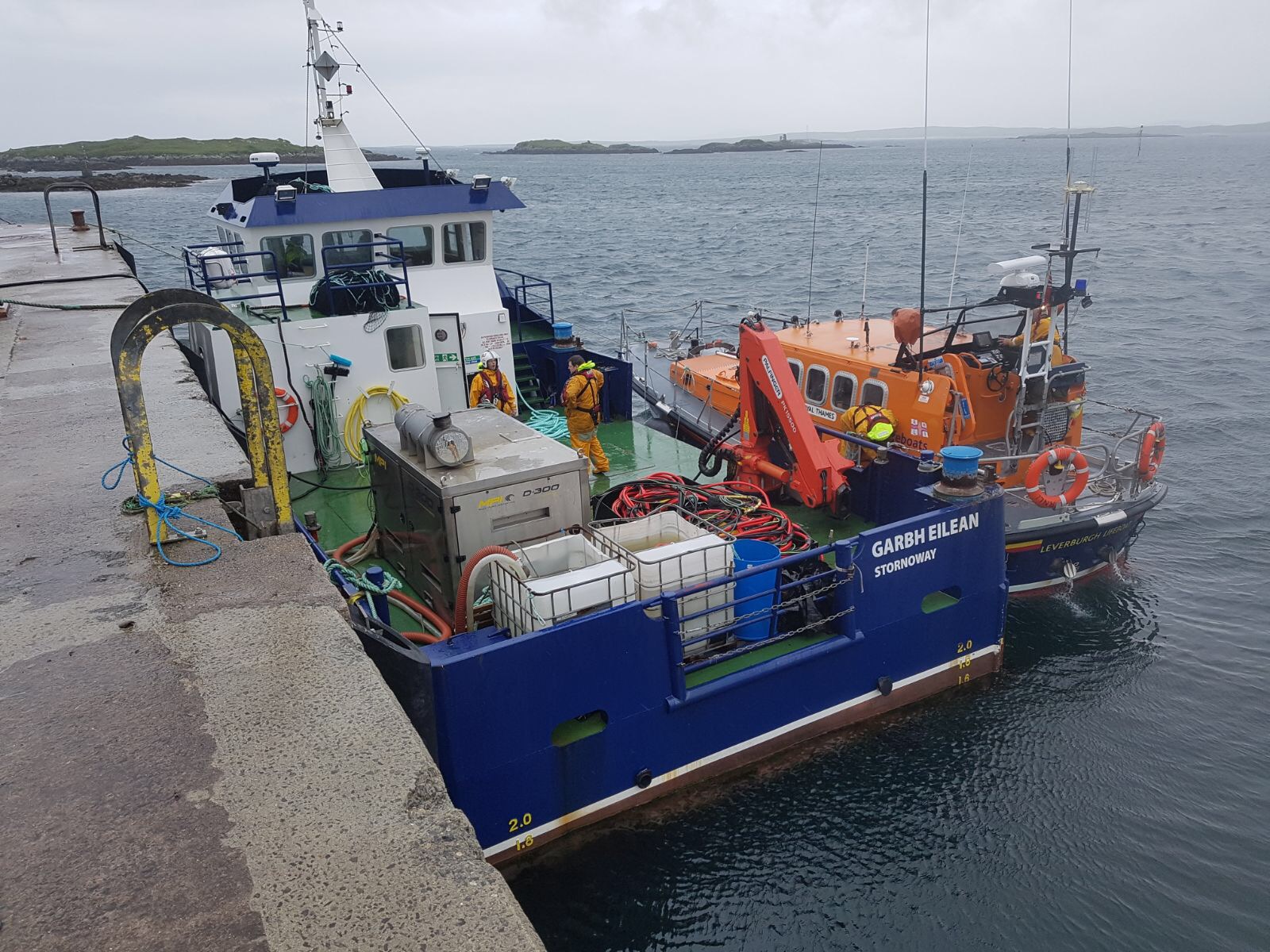 Leverburgh Lifeboat and Fishfarm vessel safely tied up in Leverburgh