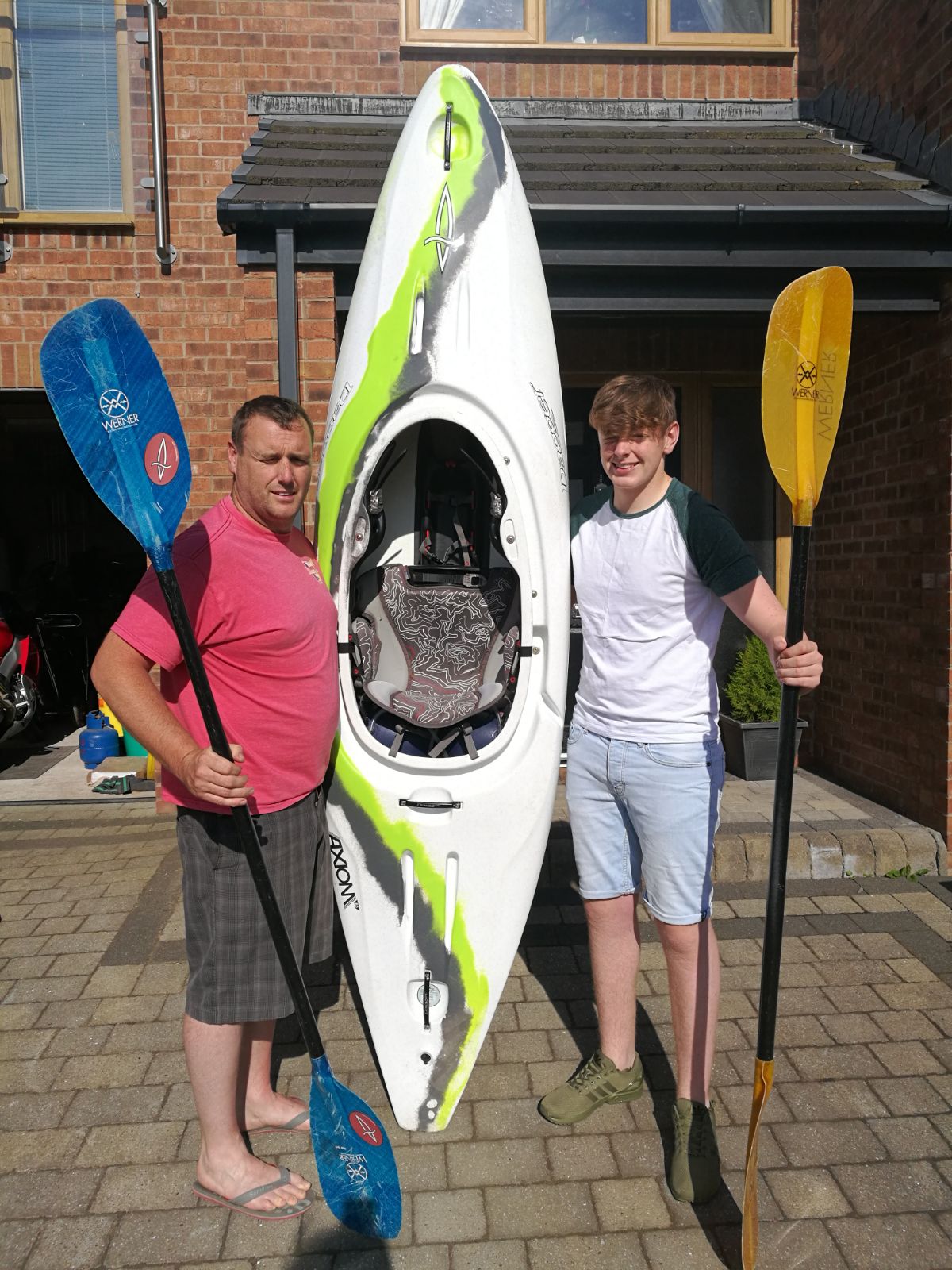 Chris Evans with his son Tom and their canoe