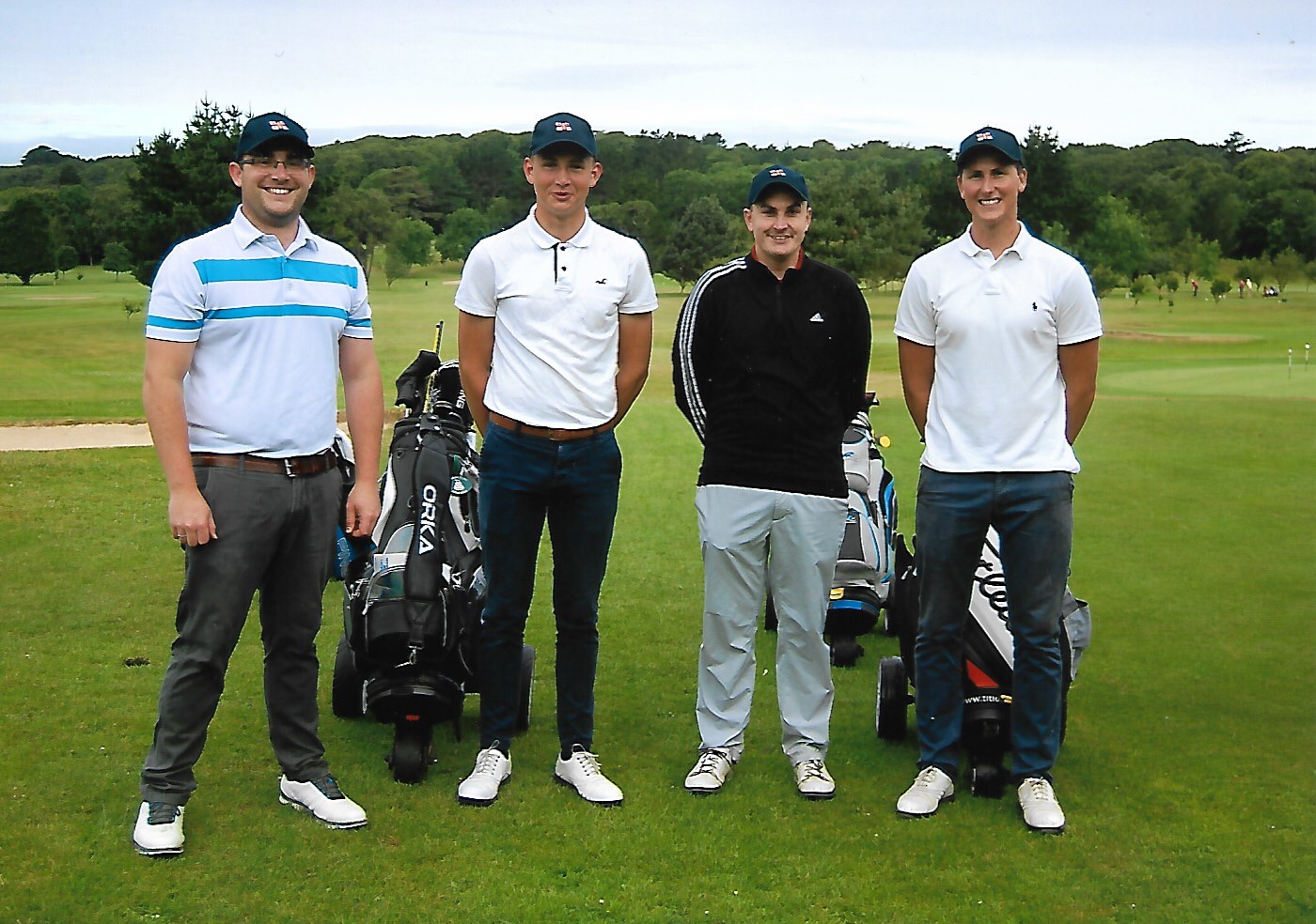 Photograph of four golf fundraisers 