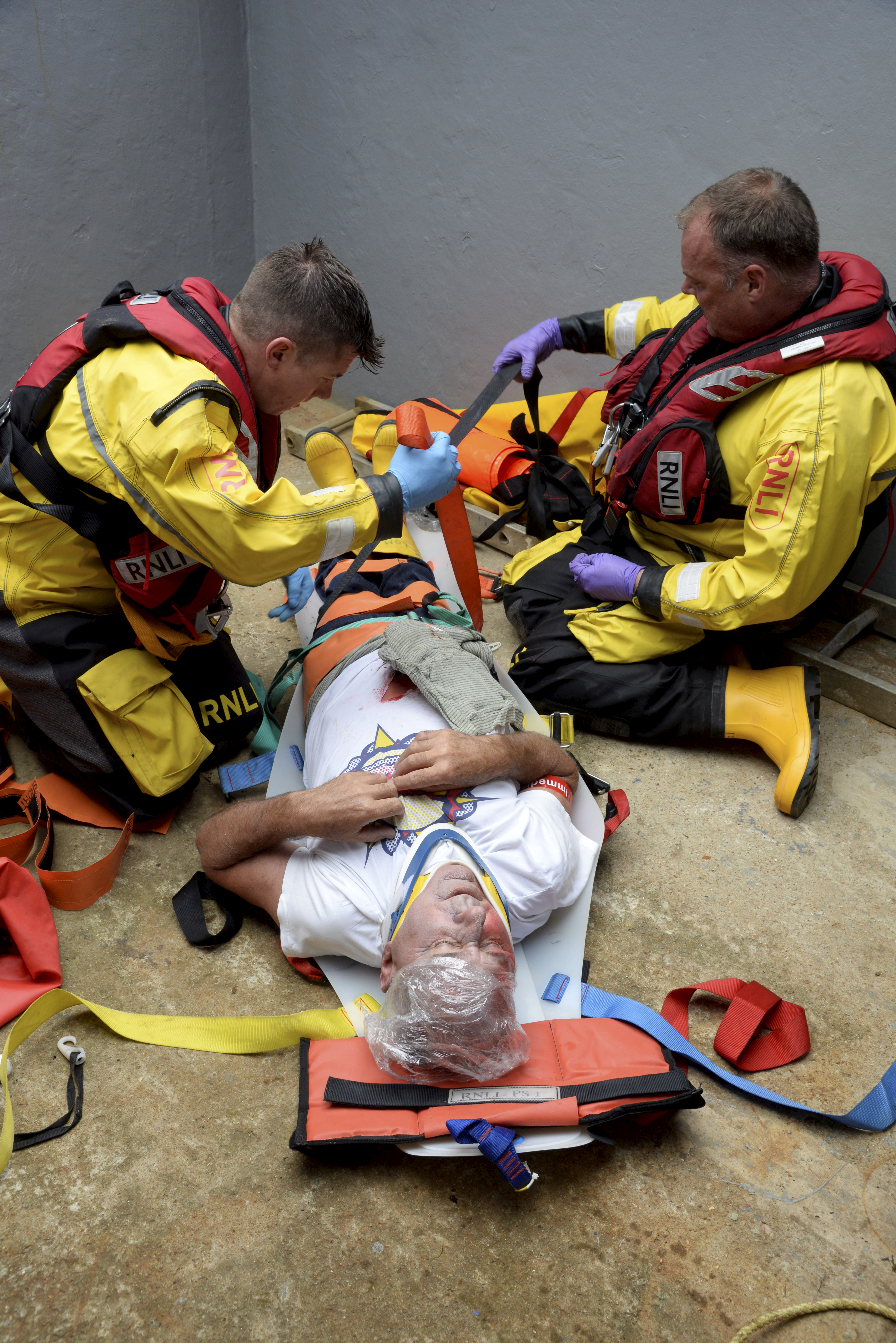 Oz Warren and Tim Smith tackle the difficult task of dealing with casualty Tony Wood in the hold of the cockle dredger 'Oly Ray' during the 2017 Whitstable Lifeboat Dan Davies Seamanship and First Aid Competition on Saturday