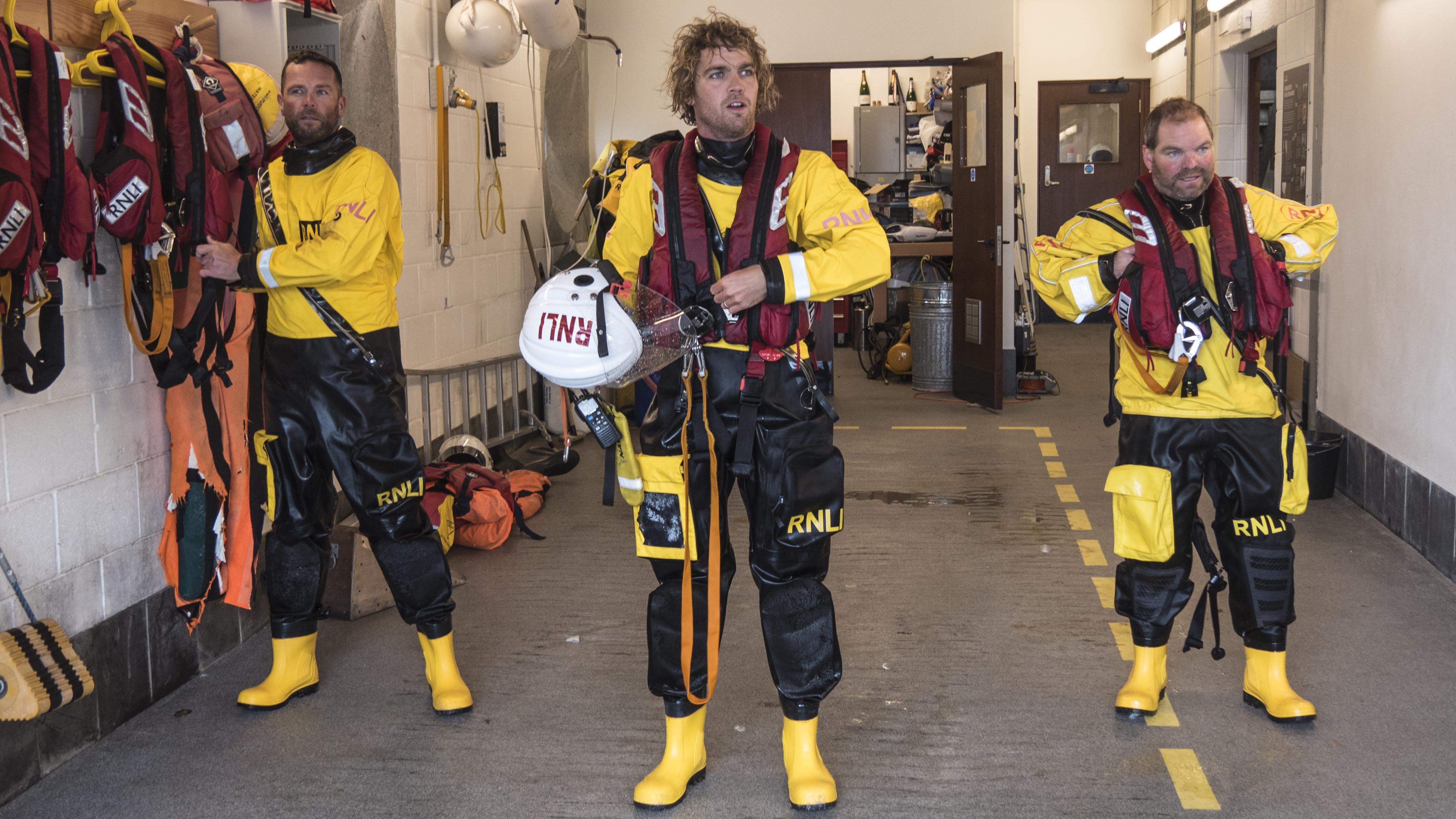 Helm George Deacon with crew members Jack Coop and Peter Tanner at the station after the call out.
