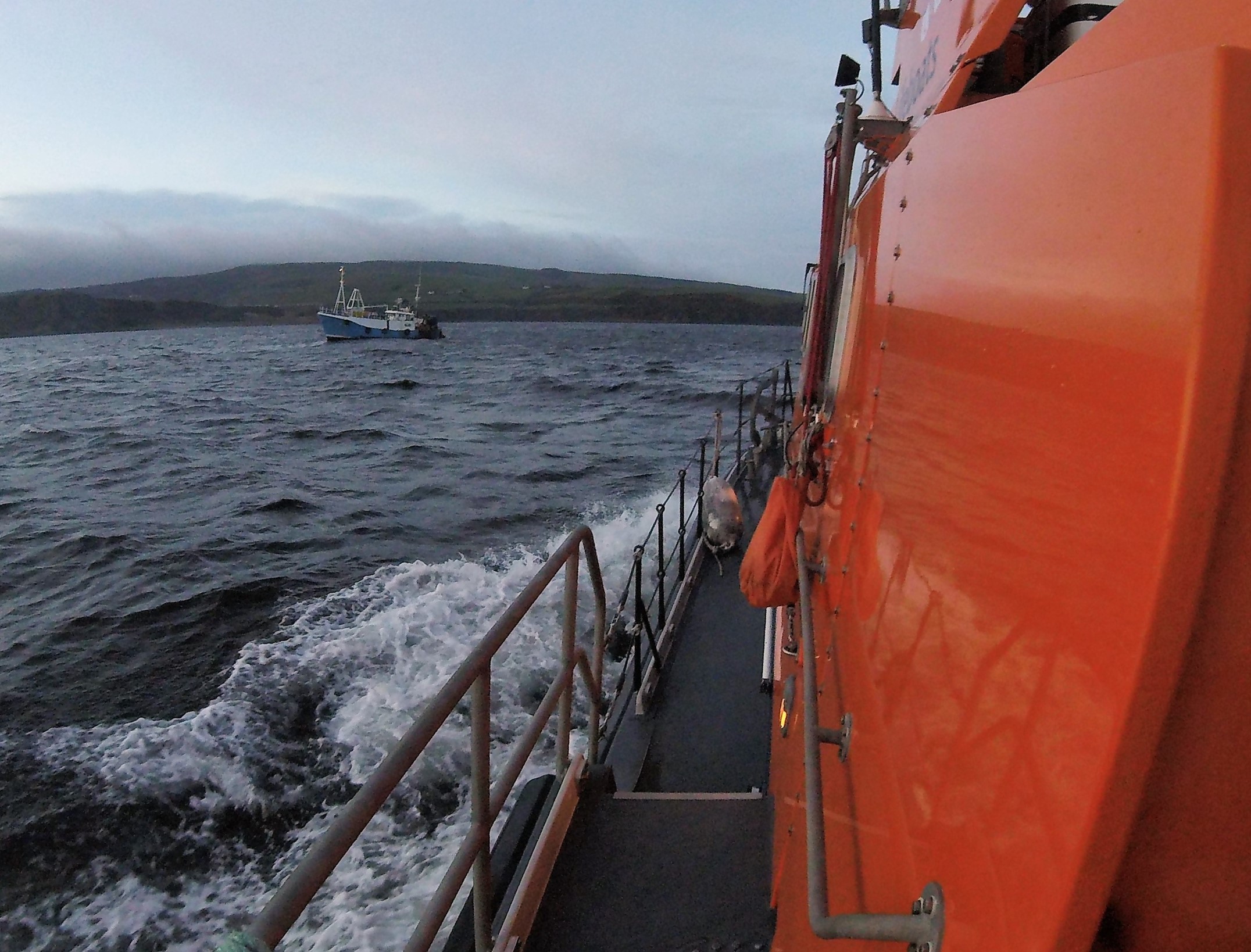 Trent class all-weather lifeboat RNLB Jim Moffat approaching the fishing vessel