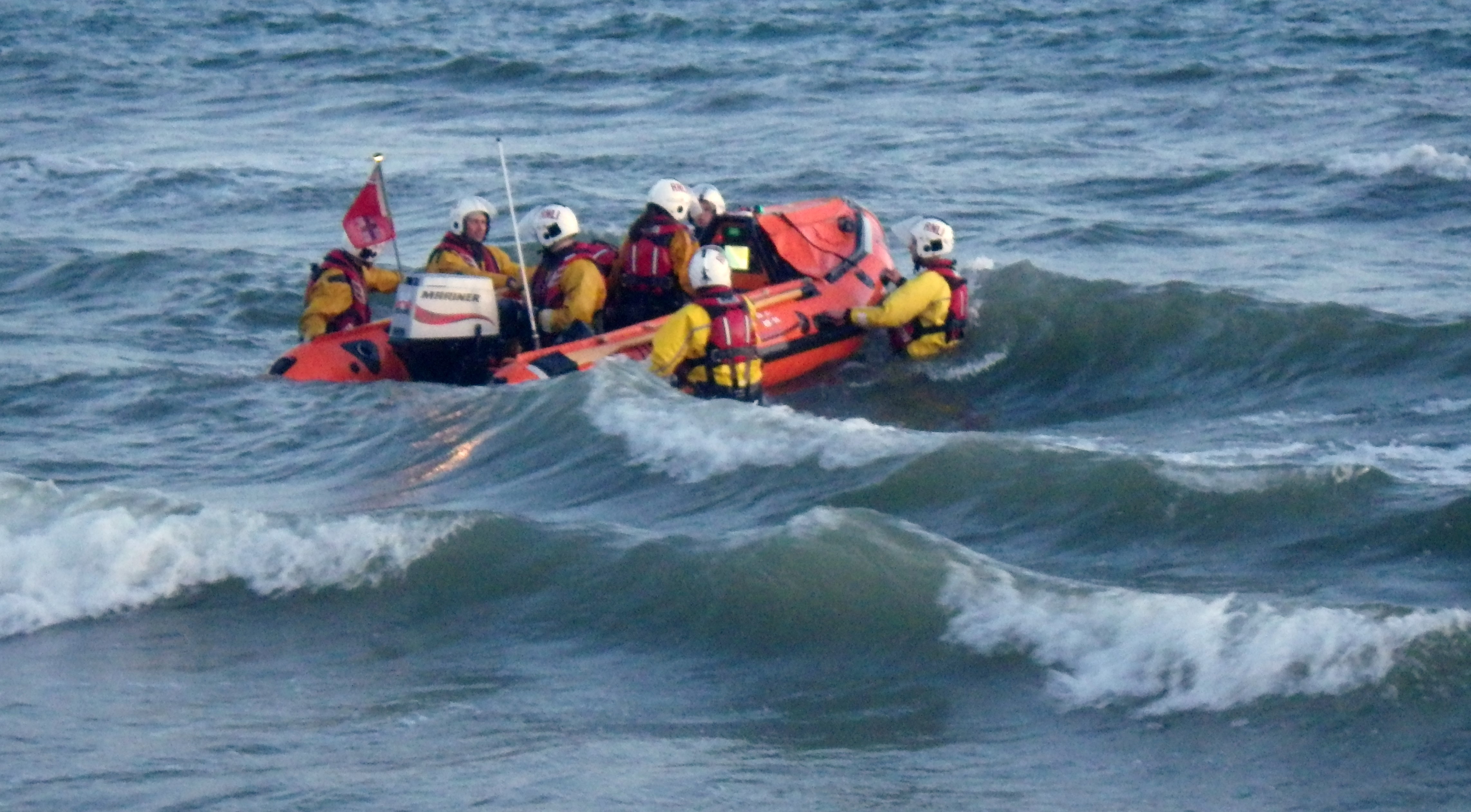 The lifeboat launches off the beach