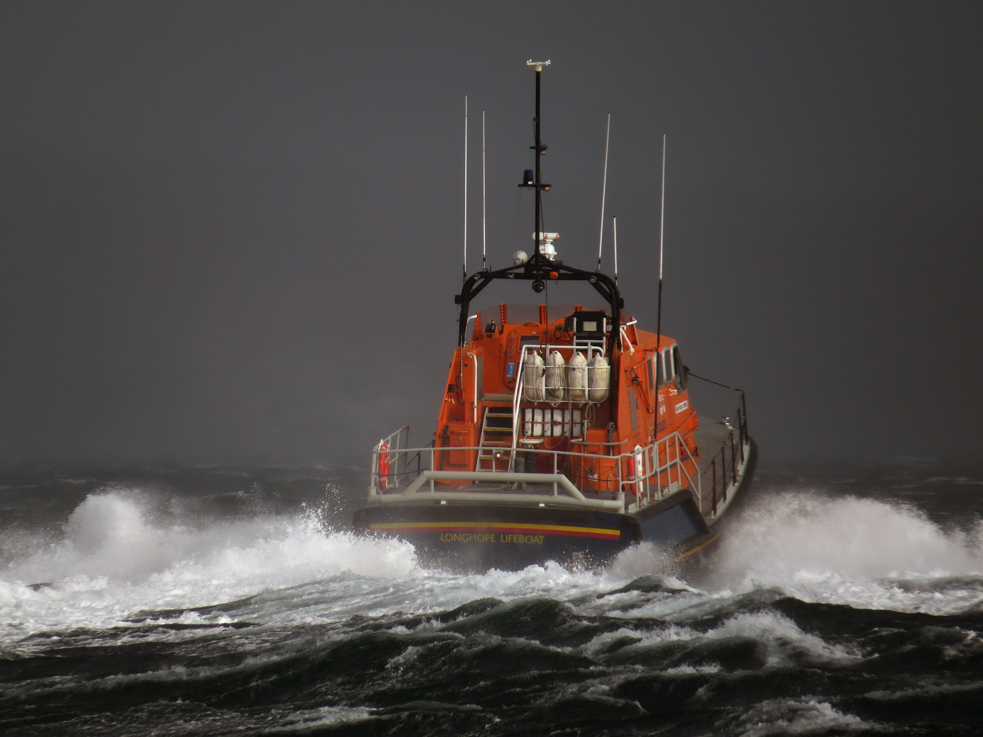 RNLI Longhope Lifeboat leaving station to assist Kirkwall Lifeboat