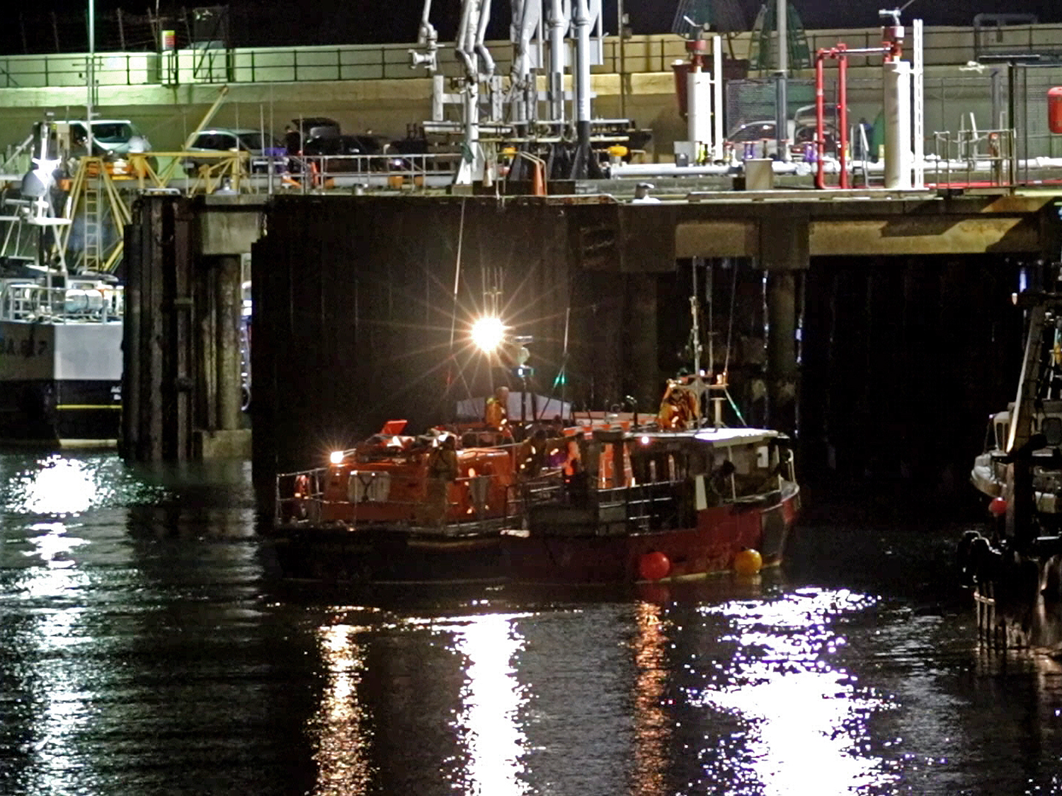 Douglas lifeboat Sir William Hillary berthing the casualty vessel at the Battery Pier