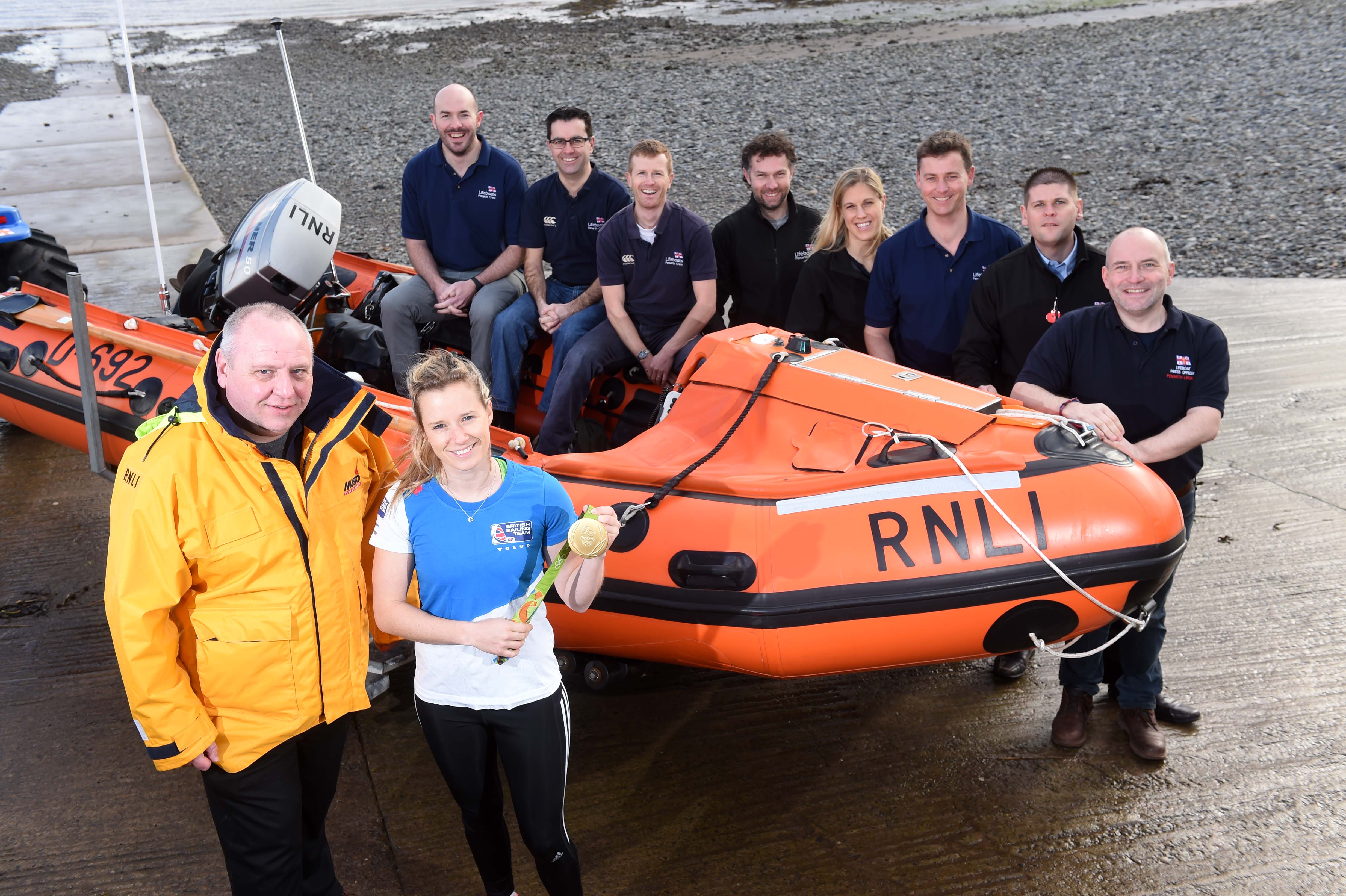Olympic Gold sailing medallist and RNLI supporter Hannah Mills congratulates Penarth RNLI on their fundraising success