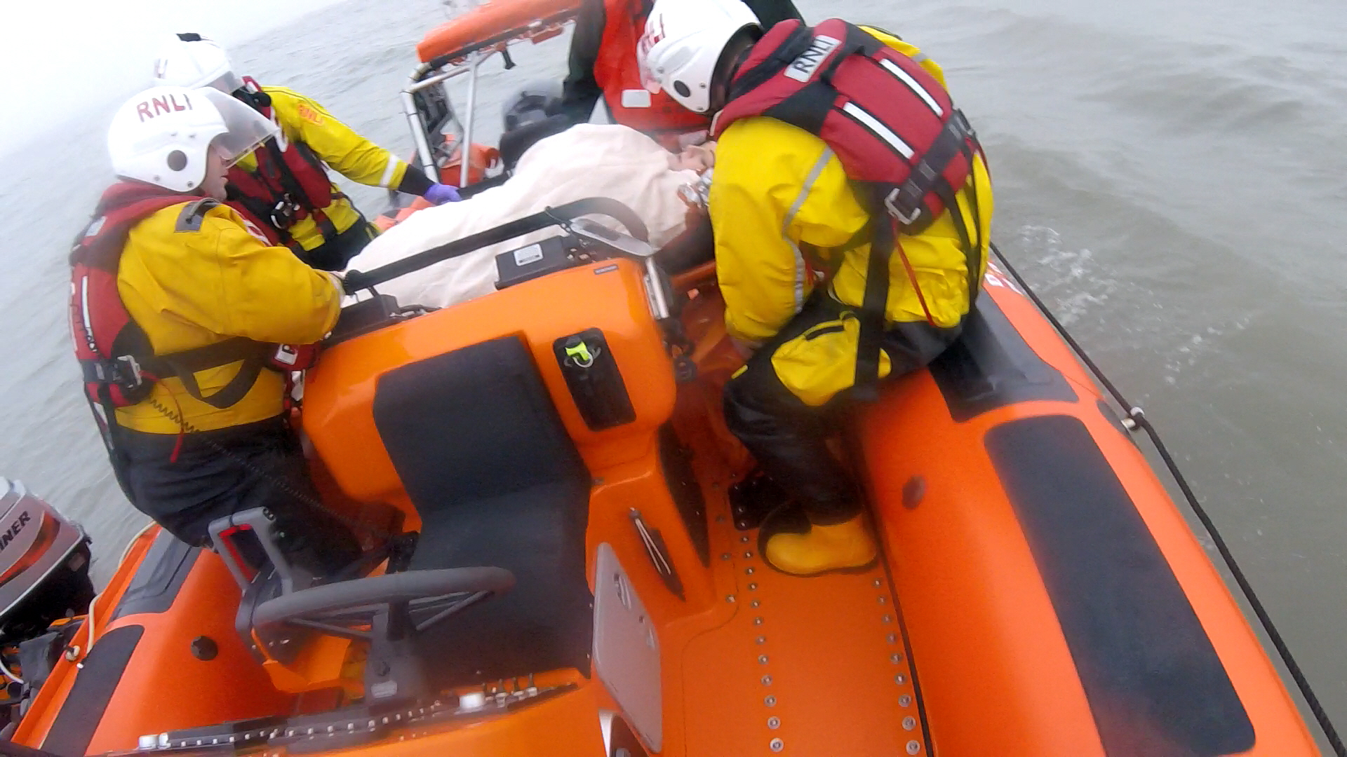 Strechered casualty being made secure before proceeding to Lifeboat Station