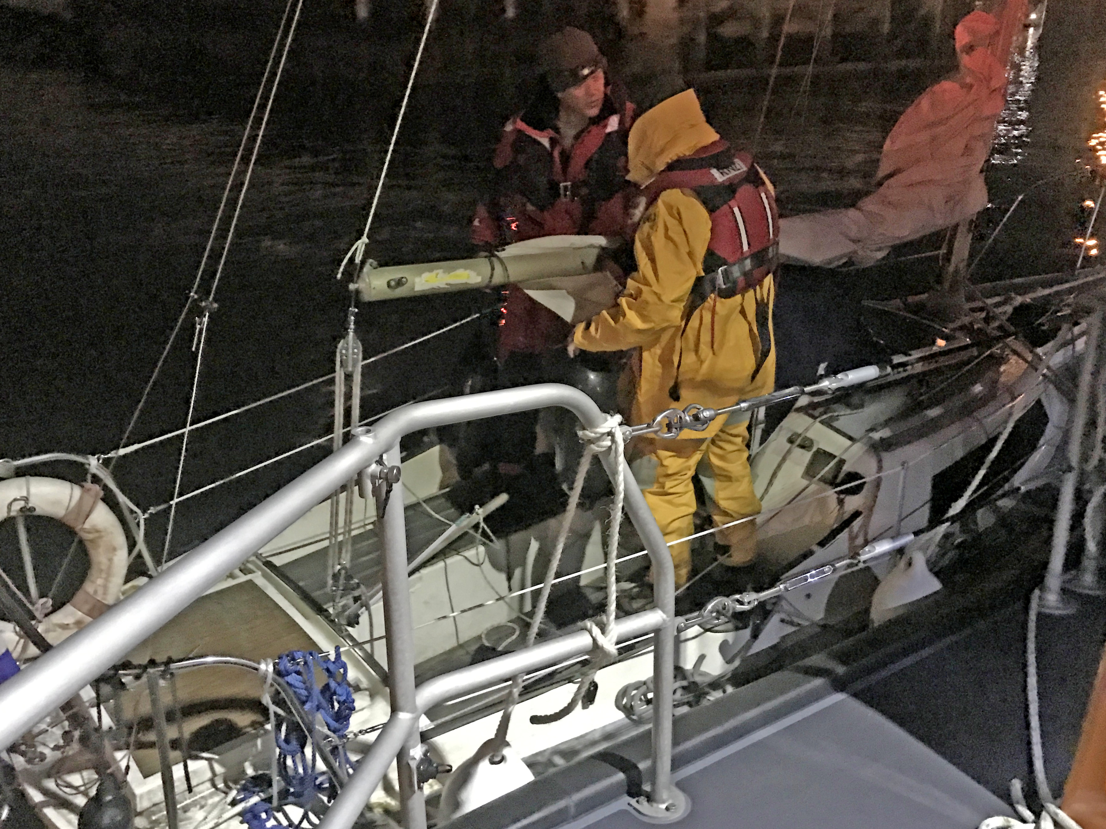A Lowestoft lifeboat crewman boards the Dutch yacht