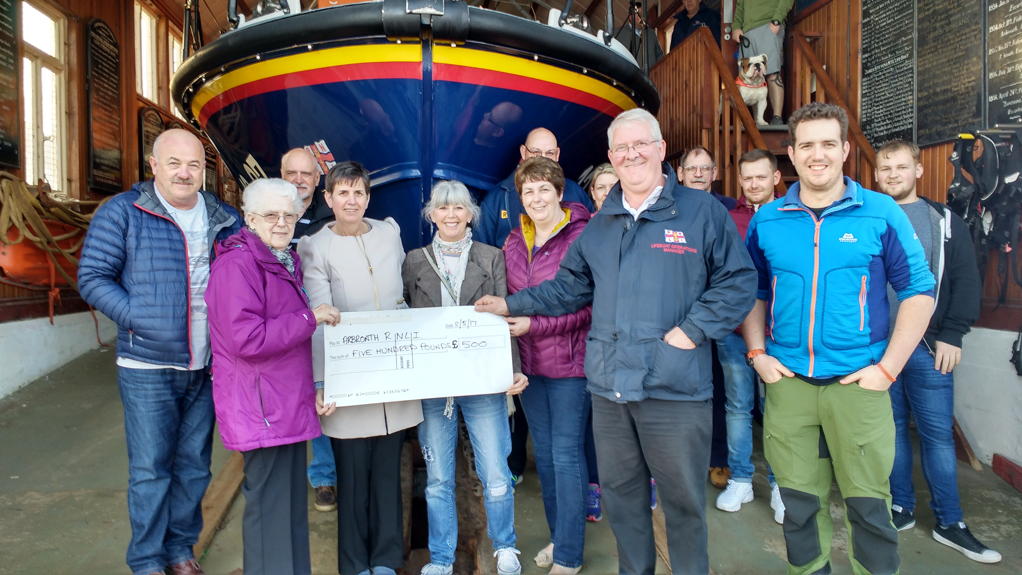 Thomson family present cheque to Arbroath crew
