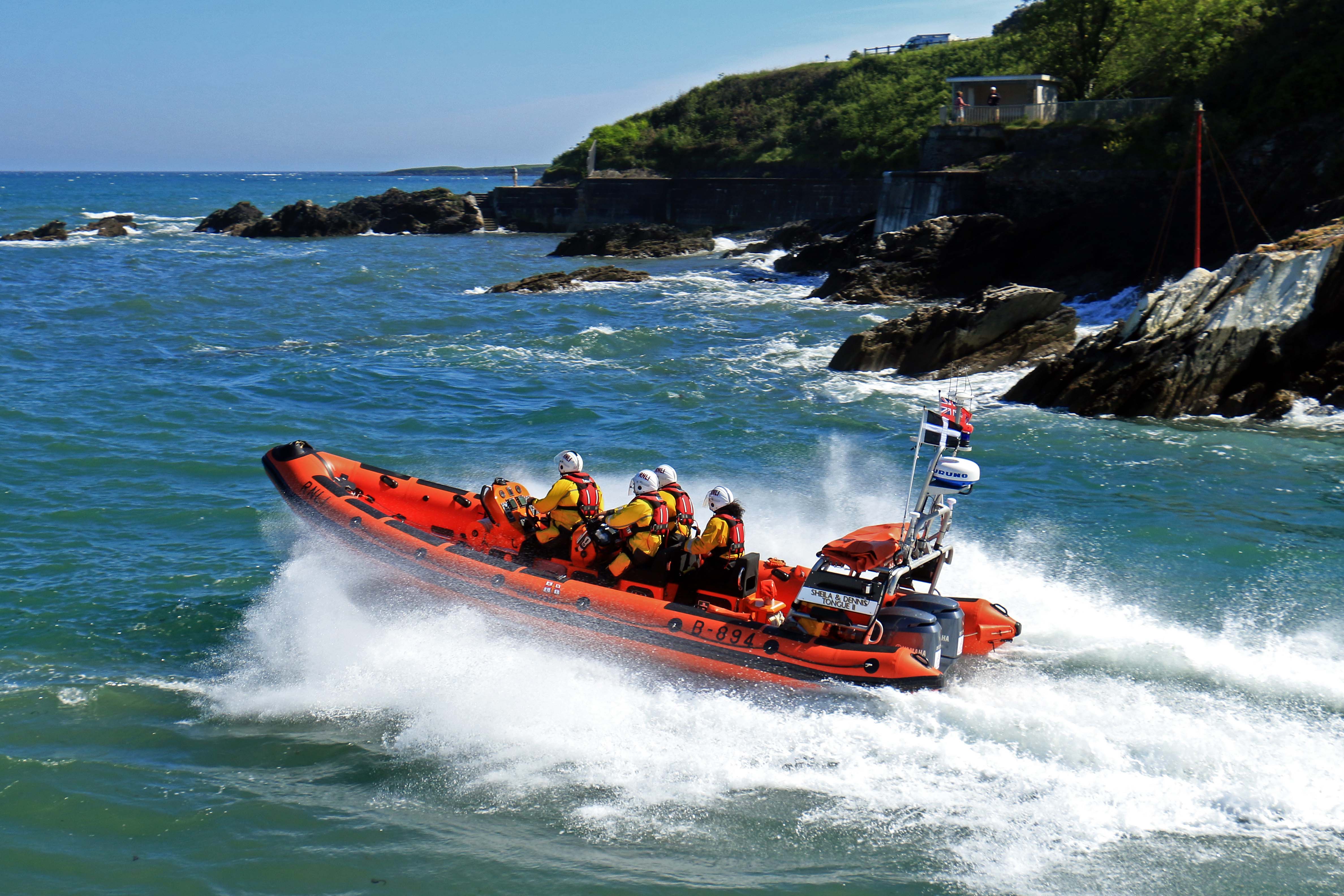 Looe RNLI Atlantic 85 Sheila and Dennis Tongue II leaving Looe and heading towards Polperro