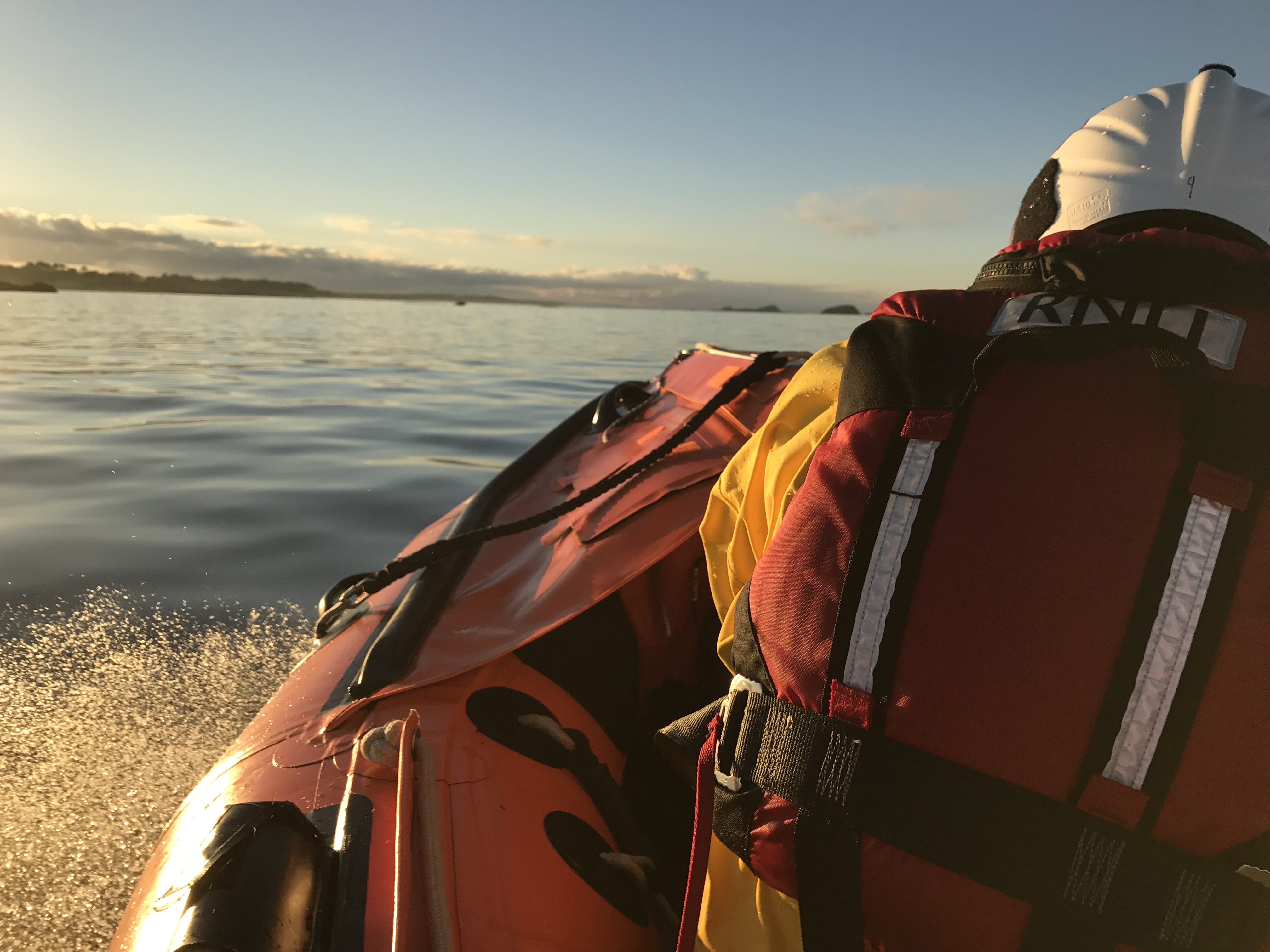 One crew member at front of inshore lifeboat.