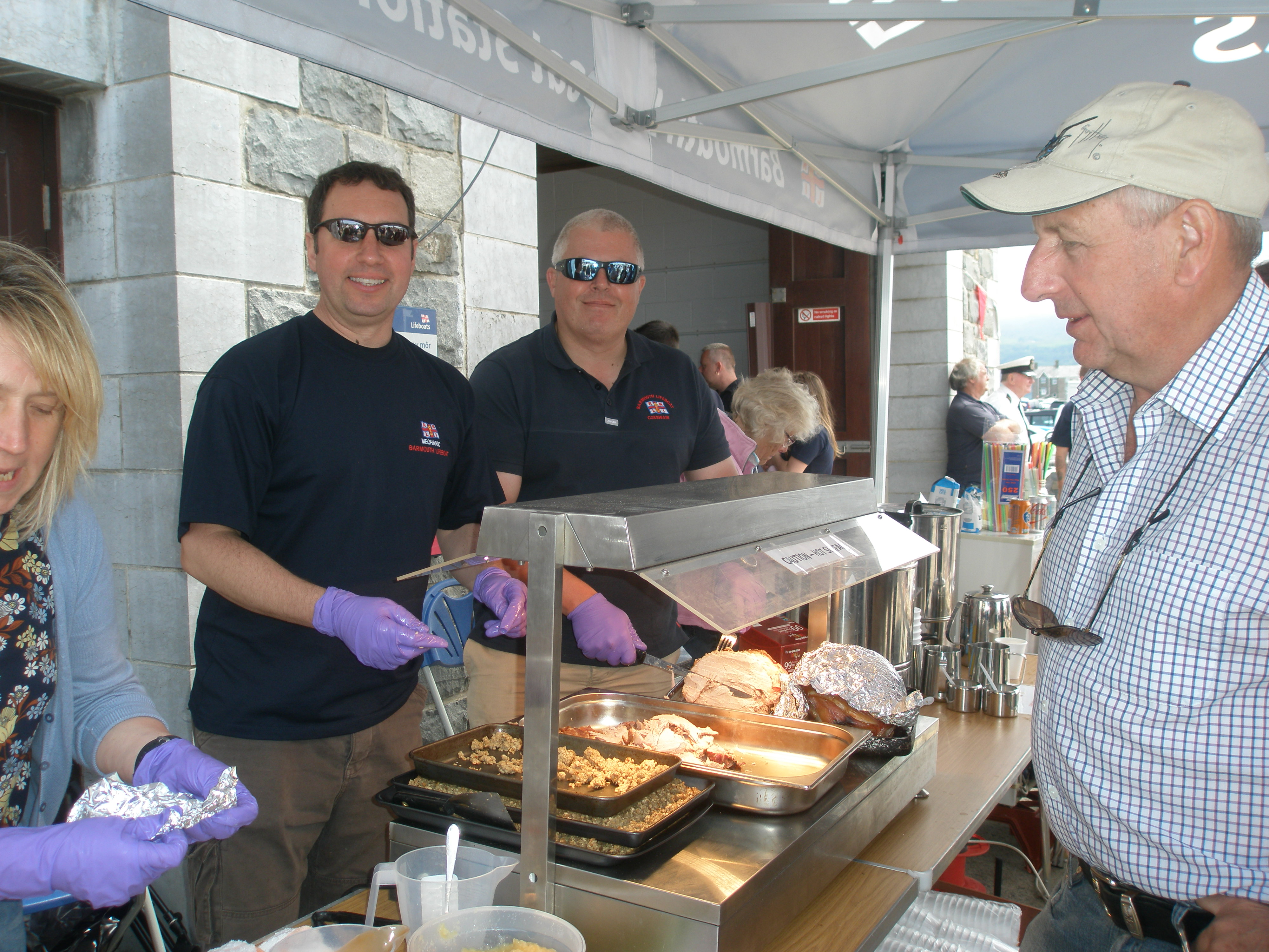 Mechanic Daryl James and Coxswain Pete Davies serve their pork baps