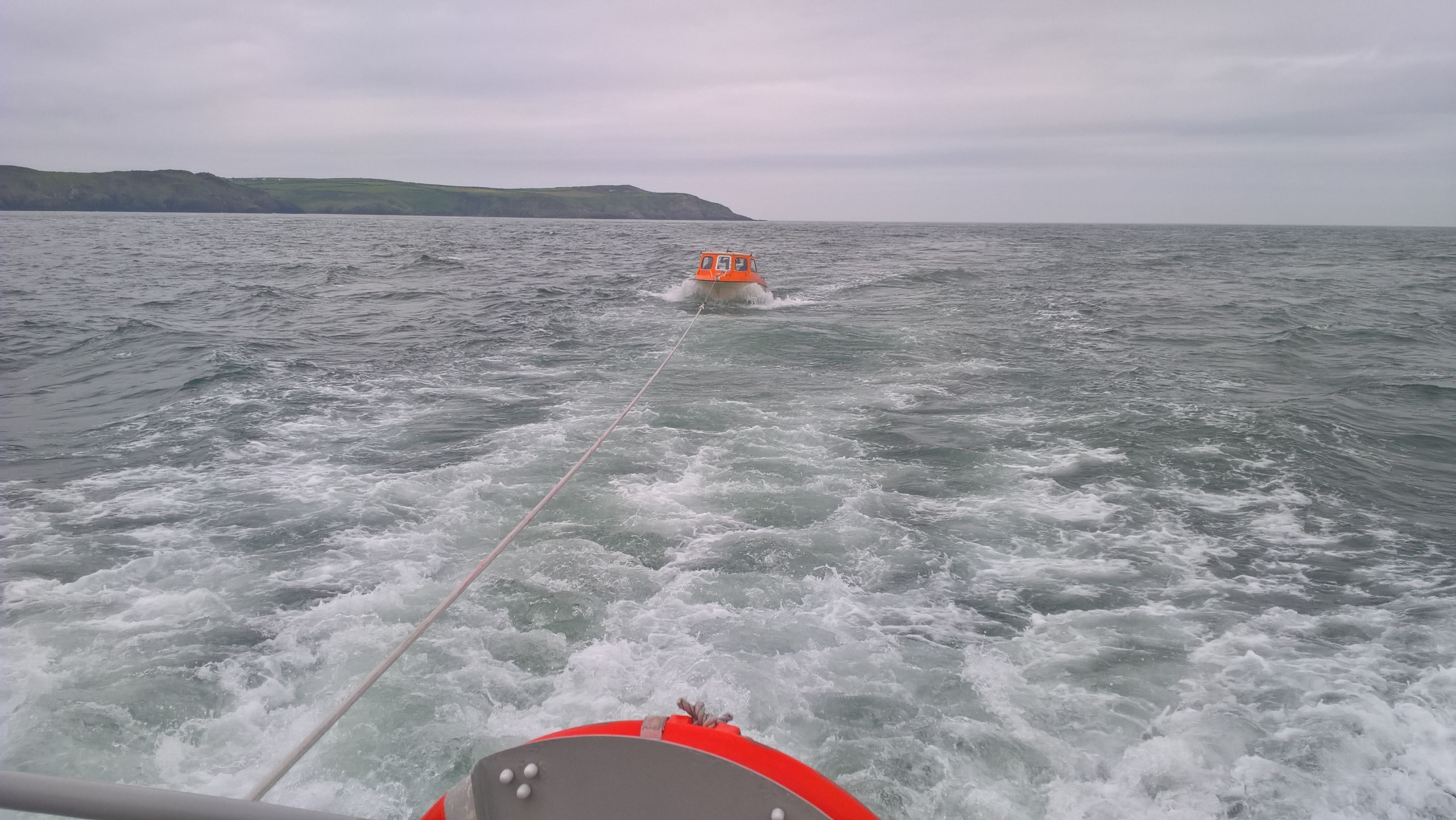 The boat with engine failure in tow behind the RNLI lifeboat