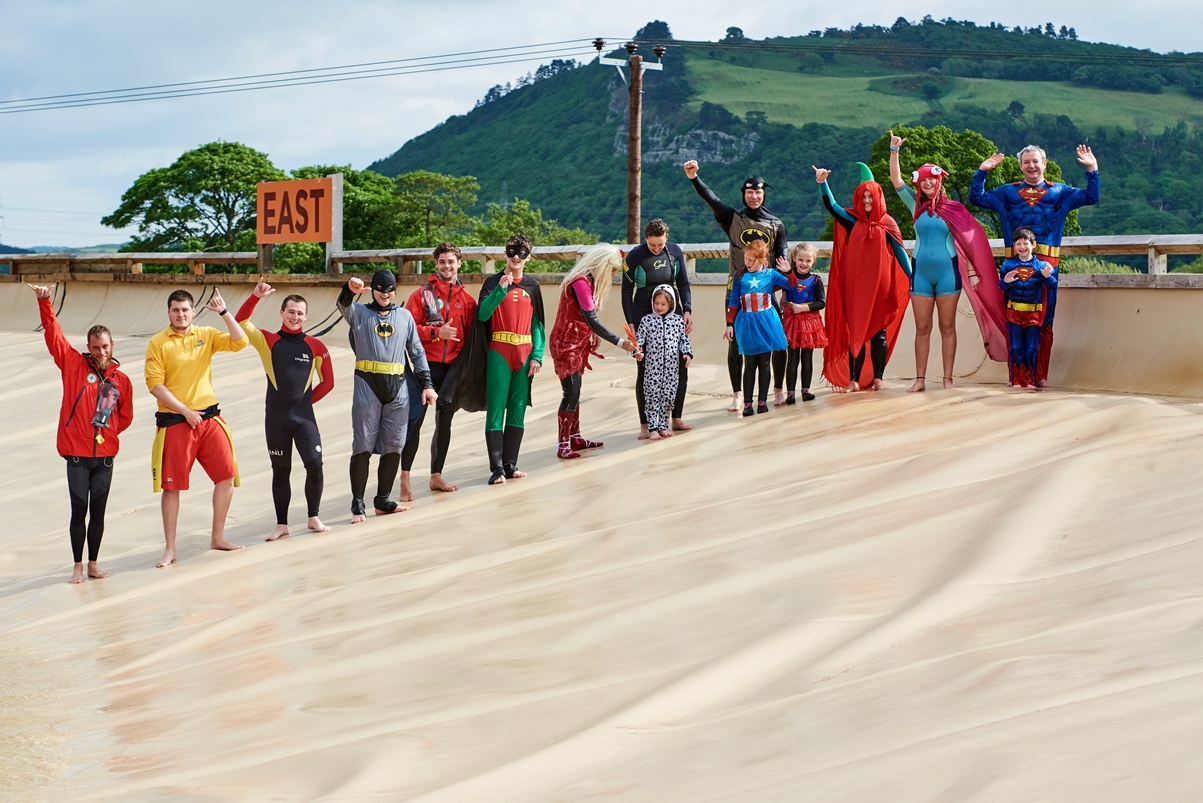 Superheroes raising money for the RNLI's Mayday campaign at Surf Snowdonia