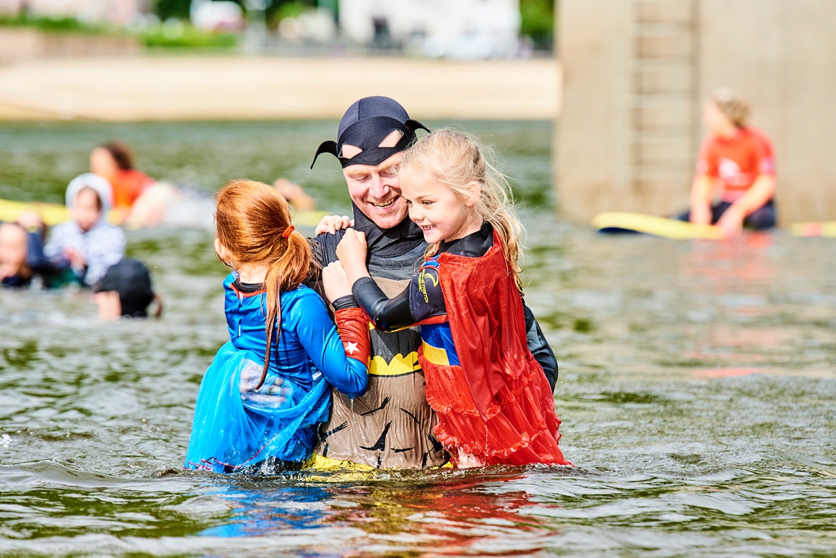 Tudur Roberts with youngsters Shona and Mia braving the waters in full costume