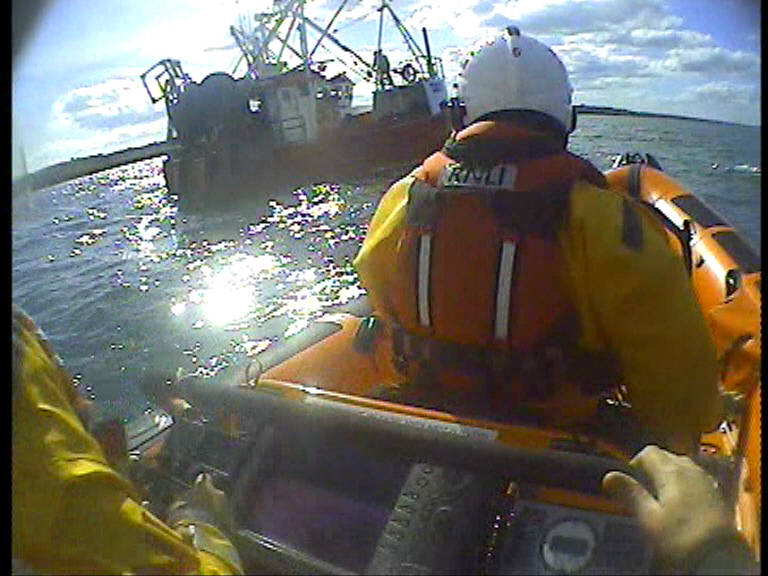 Skerries RNLI coming alongside the disabled fishing trawler.