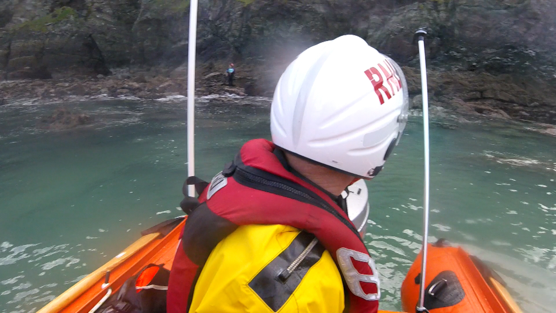 Newquay lifeboat approaches woman trapped by tide below steep cliffs