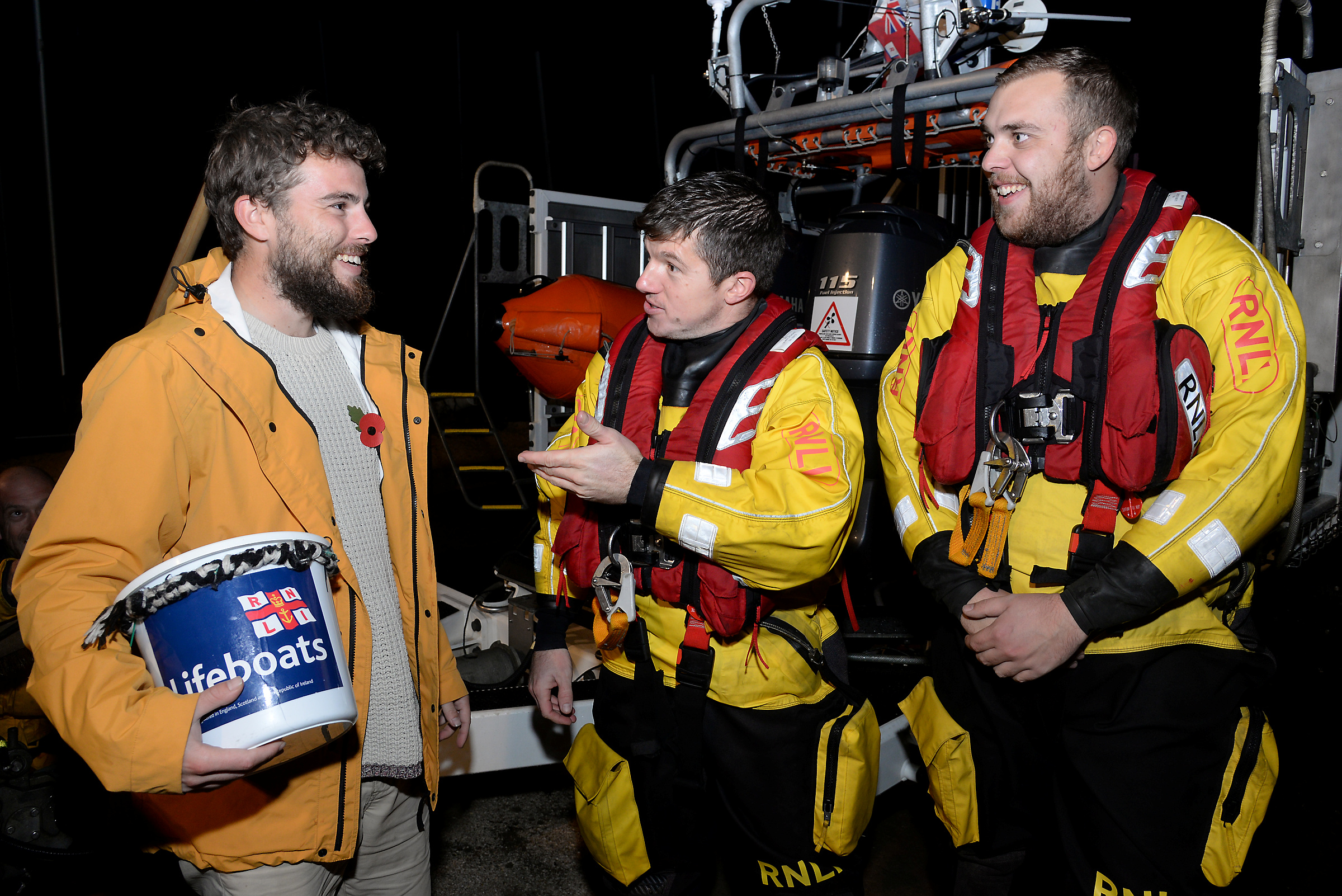 Alex Ellis-Roswell chats with Whitstable lifeboat's Oz Warren and Rob Judge on Thursday evening following the completion of the penultimate leg of his marathon 3-year walk around the lifeboat stations of Great Britain and Ireland. Picture: RNLI Whitstable