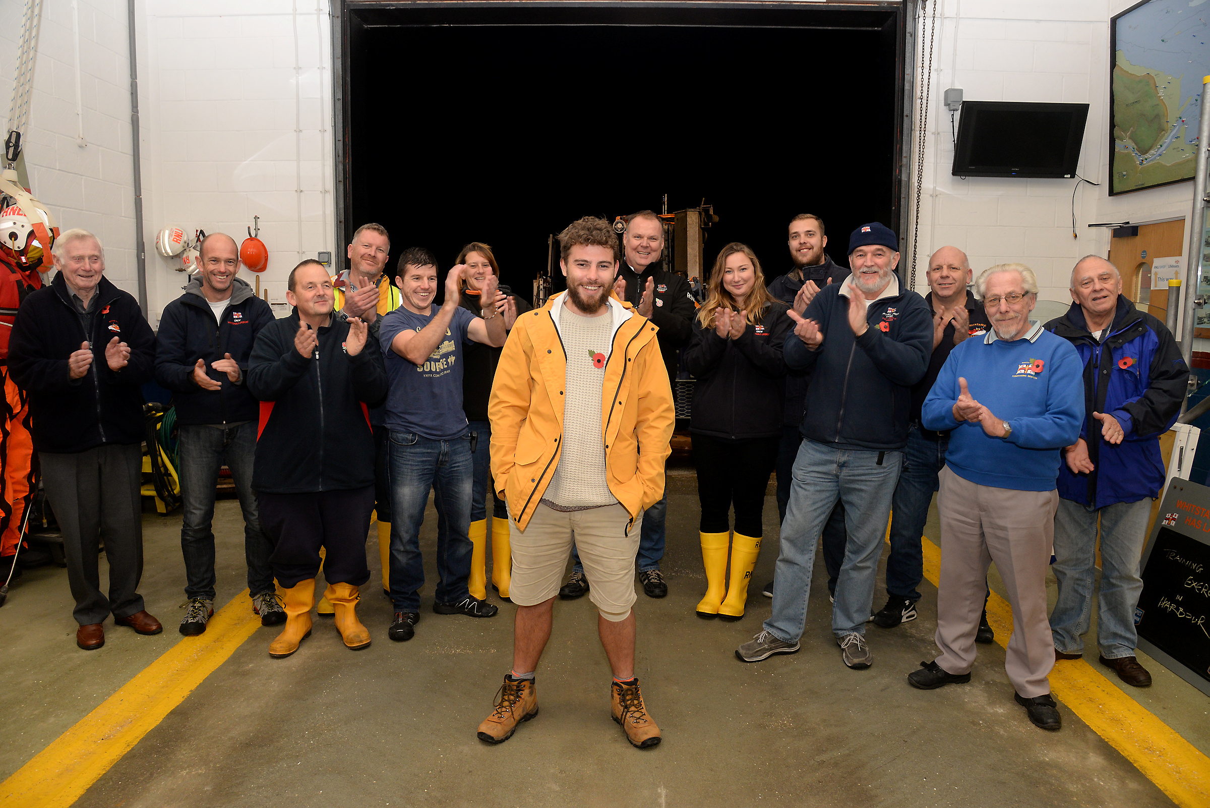 Alex Ellis-Roswell with members of the Whitstable Lifeboat Station on Thursday evening following the completion of the penultimate leg of his marathon 3-year walk around the lifeboat stations of Great Britain and Ireland. Picture: RNLI Whitstable