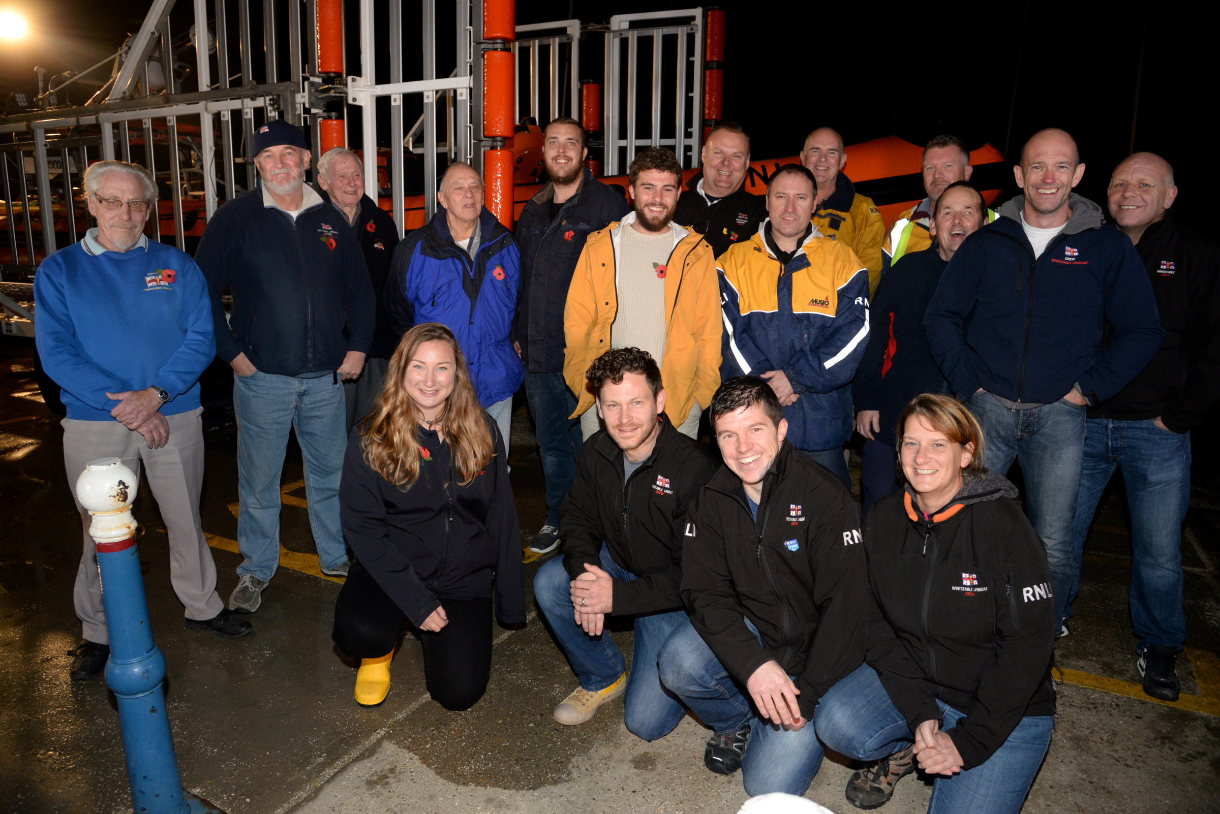 Alex Ellis-Roswell with members of the Whitstable Lifeboat Station on Thursday evening following the completion of the penultimate leg of his marathon 3-year walk around the lifeboat stations of Great Britain and Ireland. Picture: RNLI Whitstable
