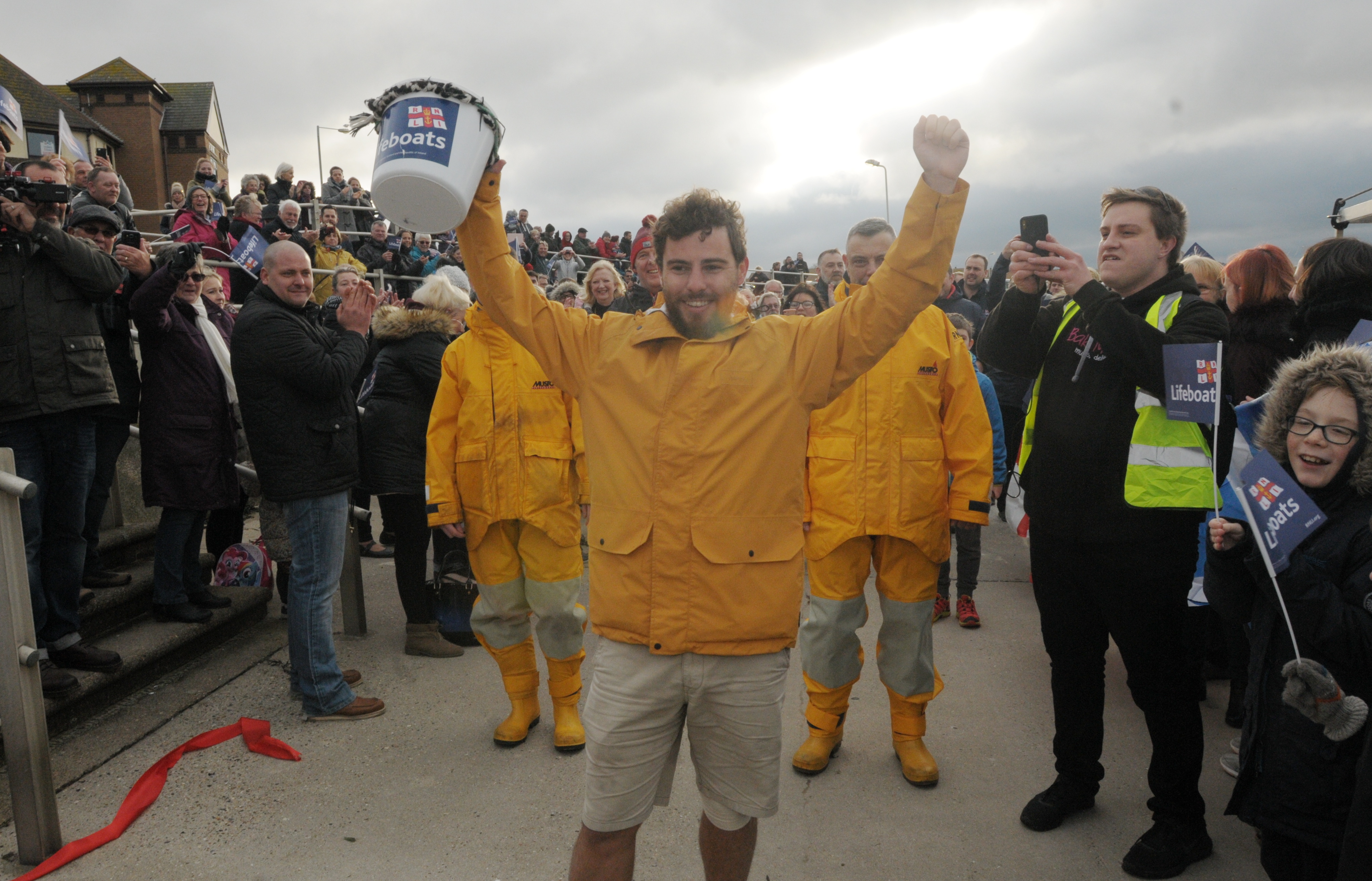Alex crosses the finishing line after 9,500 miles.