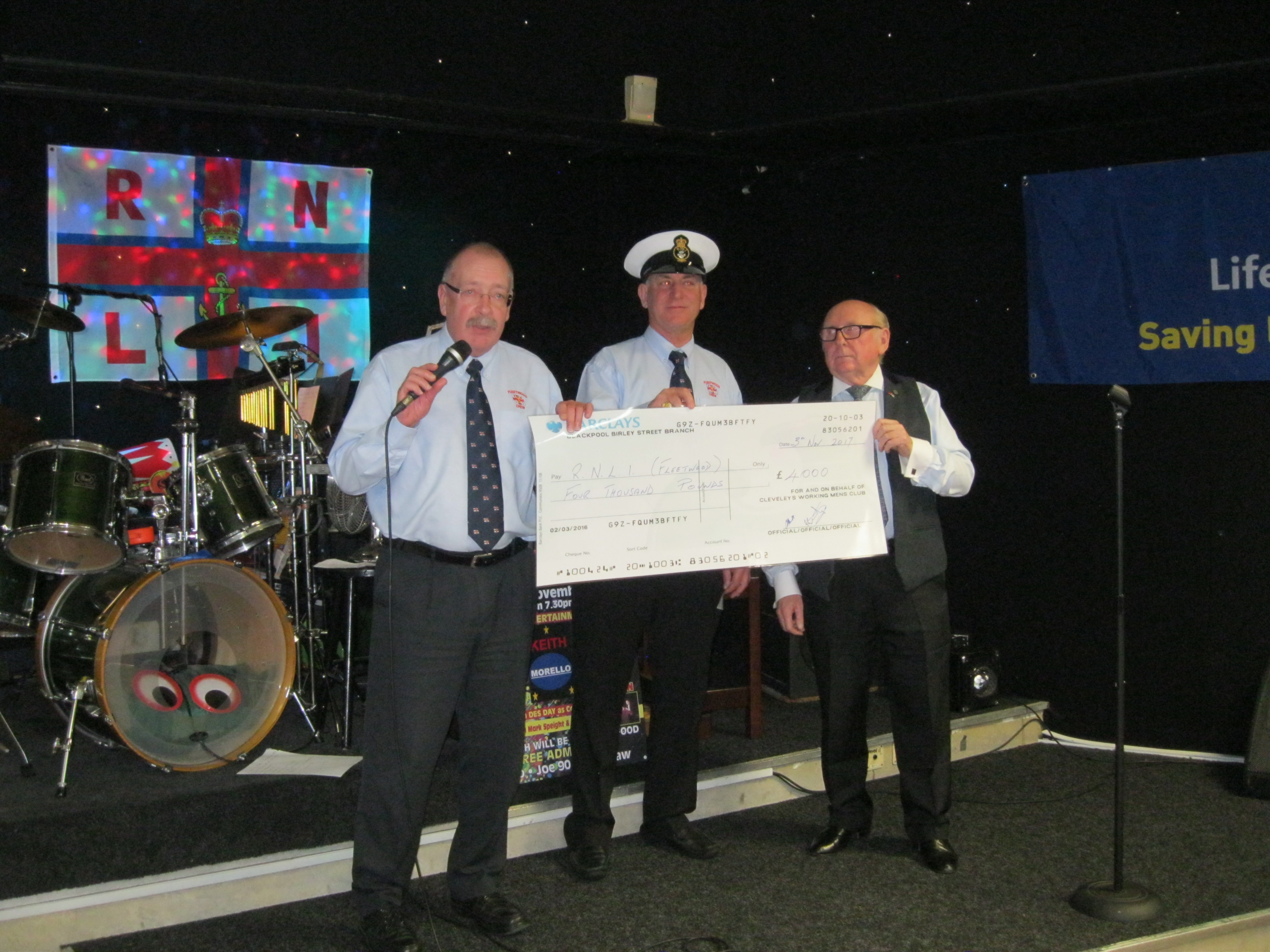 Roy Gaskell and Mark Speight presenting the £4,200 donation to Coxswain Tony Cowell.