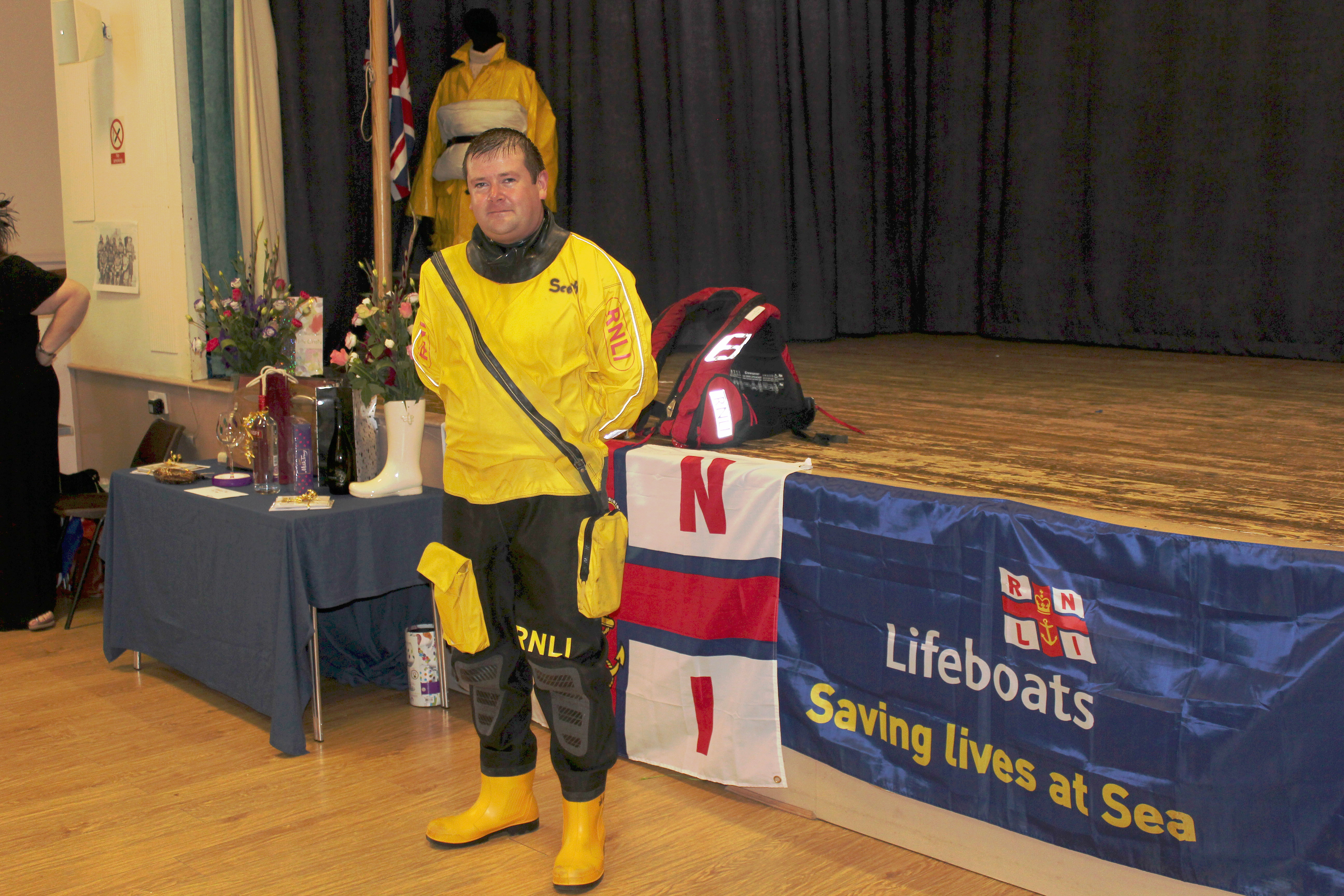 Helm Scott McIlravie models modern PPE at Afternoon Tea event